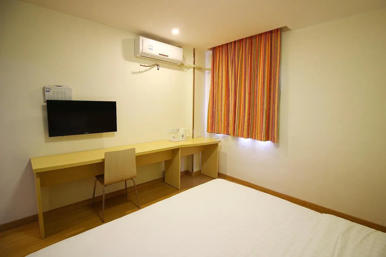 Bed in 7Days Inn Zhuhai Doumen district government pedestrian street Bed in 7Days Inn Zhuhai Doumen district government pedestrian street