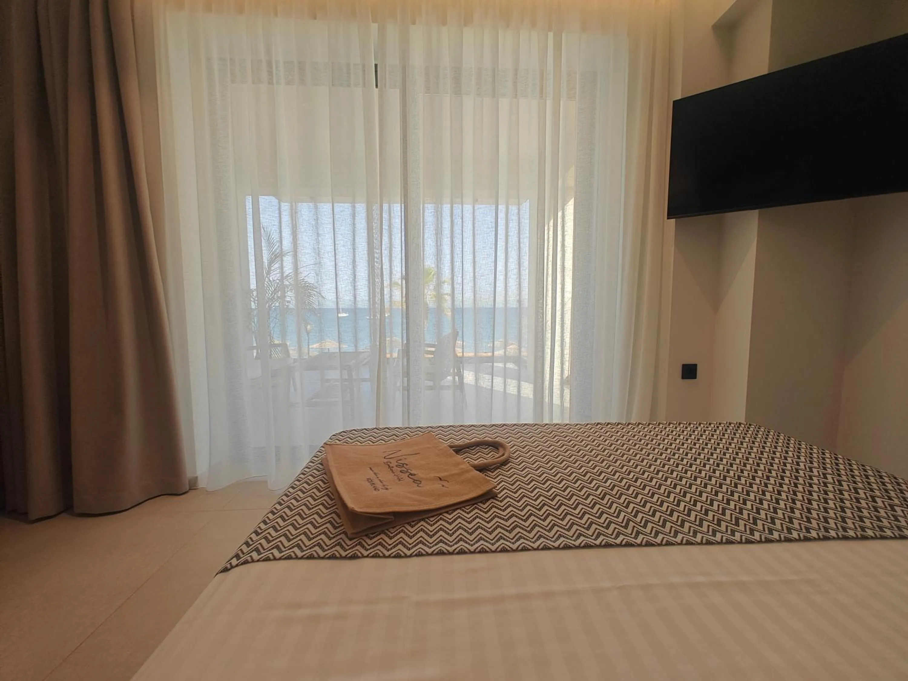 Bed in NISSEA Boutique Hotel
