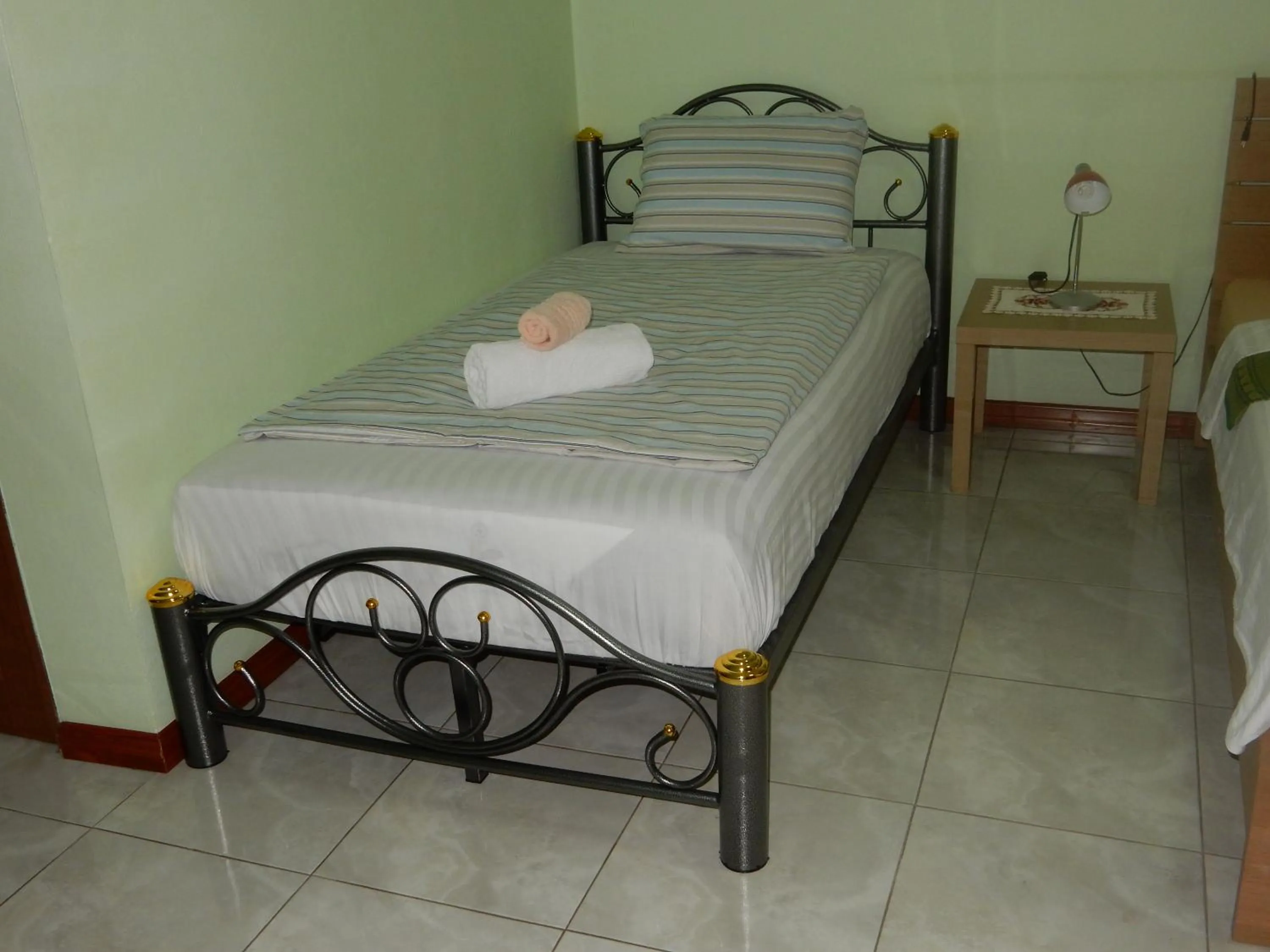 Bed in Malee Resort