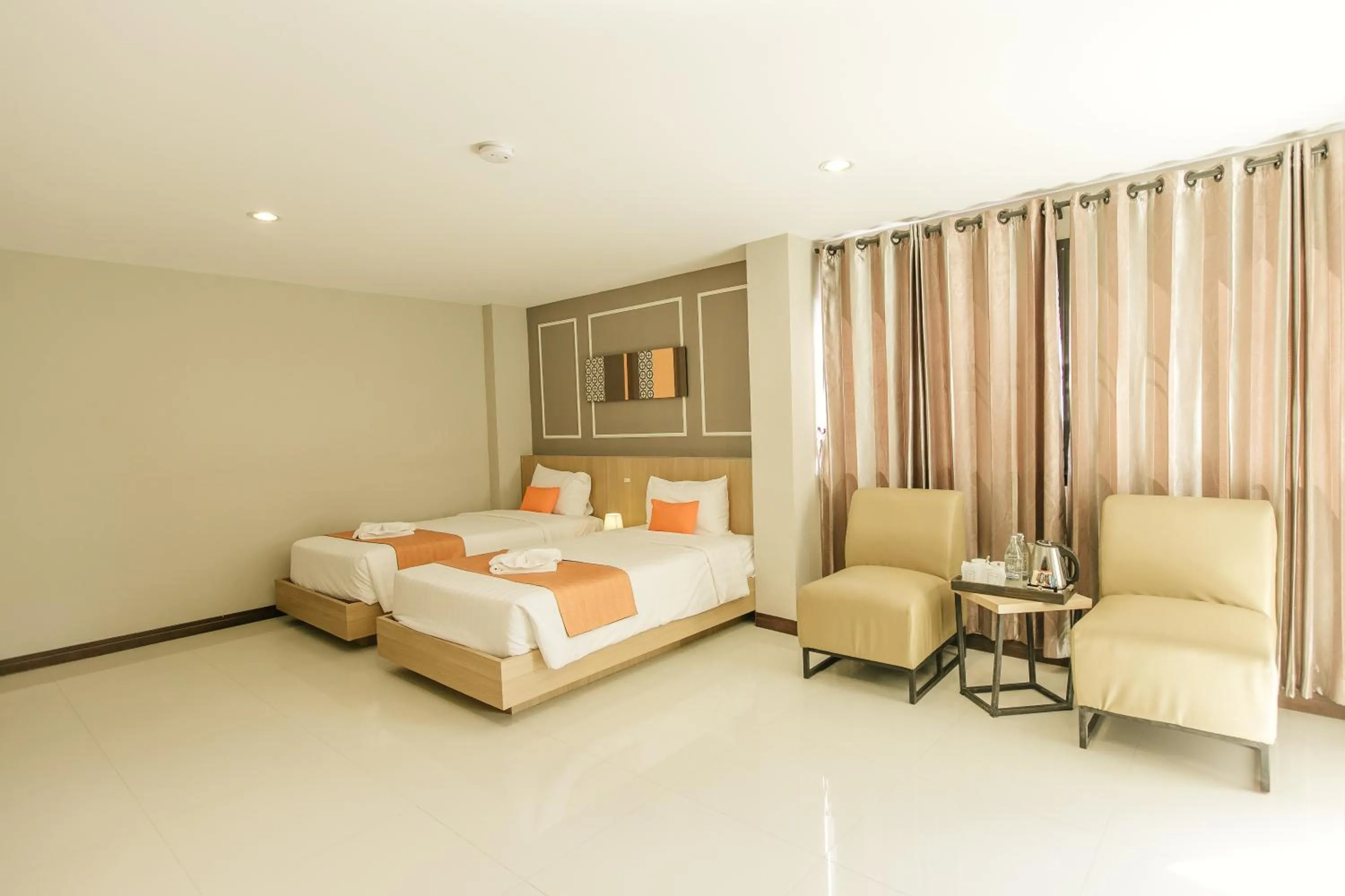 Bed in De Hug Hotel & Residence