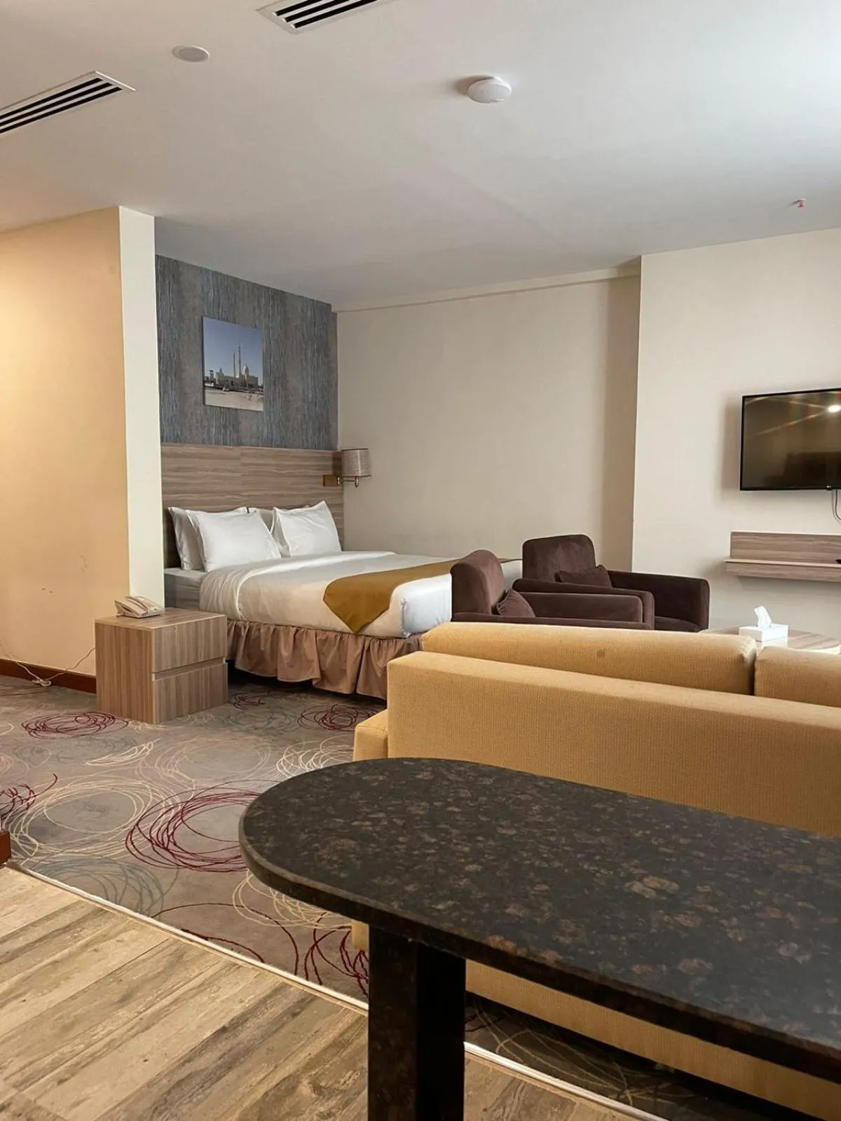 Living room, Bed in Grand Tourist Hotel