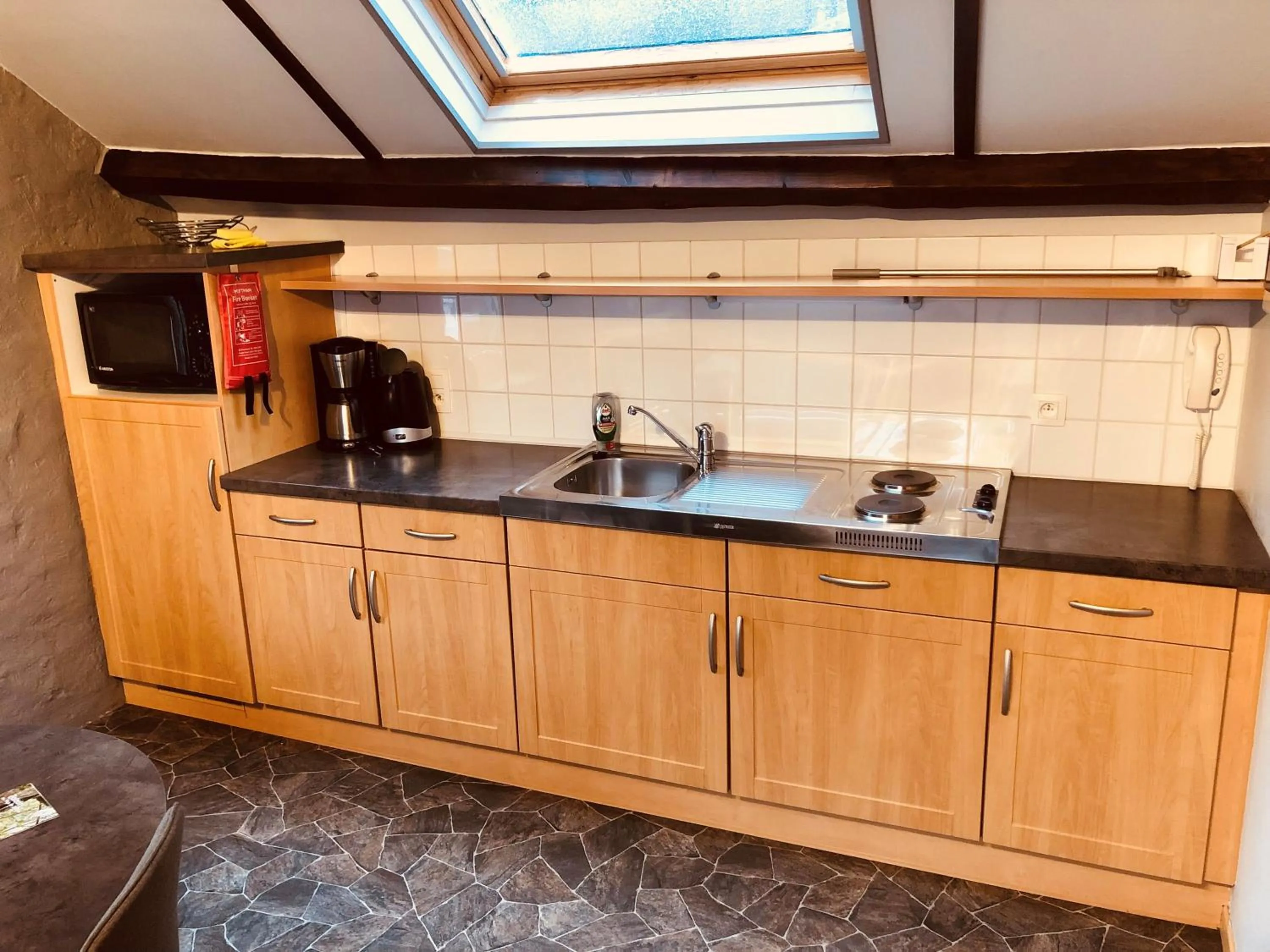 Kitchen or kitchenette in Appart Hotel Au Pied de Vigne