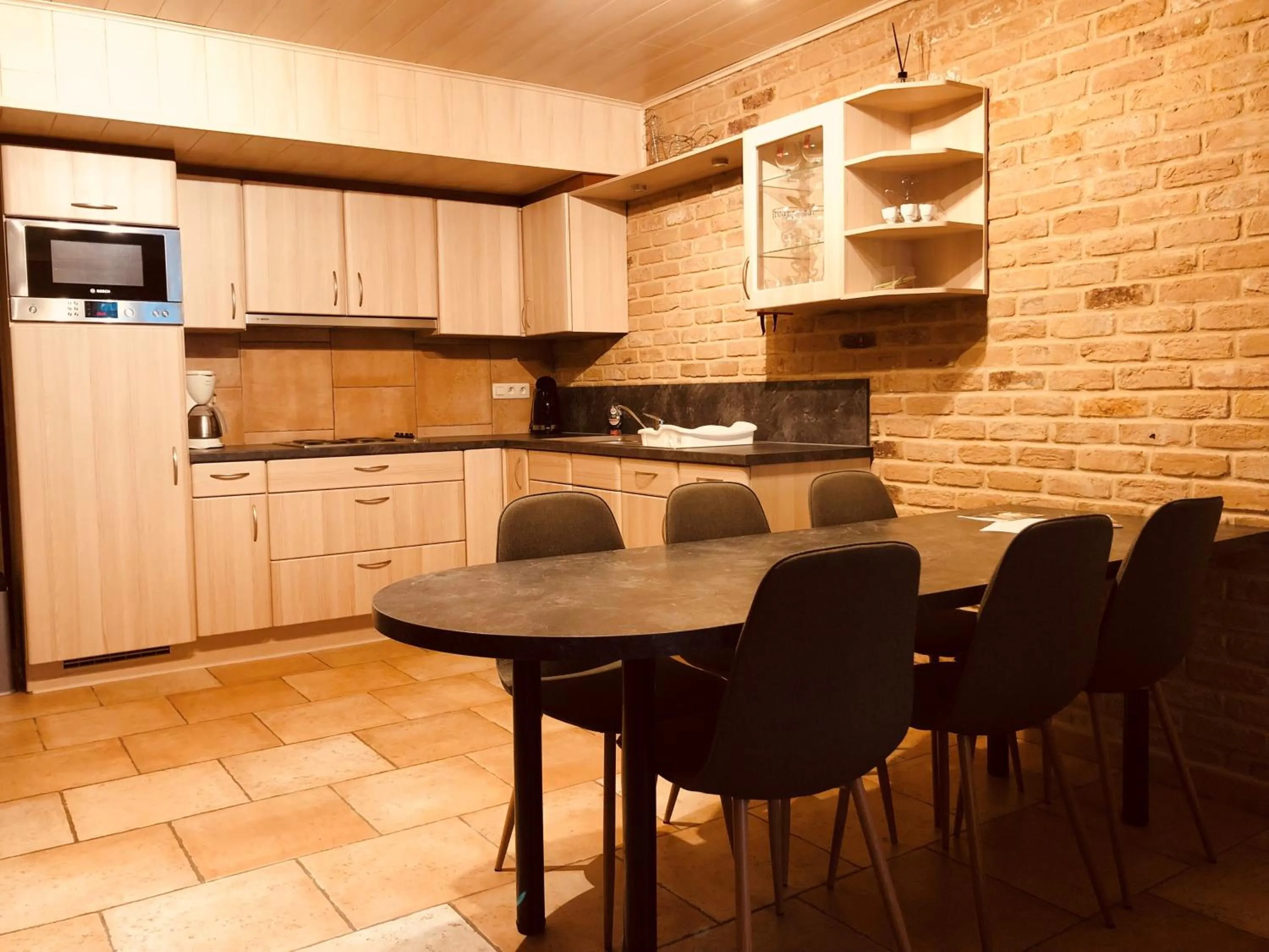 Kitchen or kitchenette in Appart Hotel Au Pied de Vigne