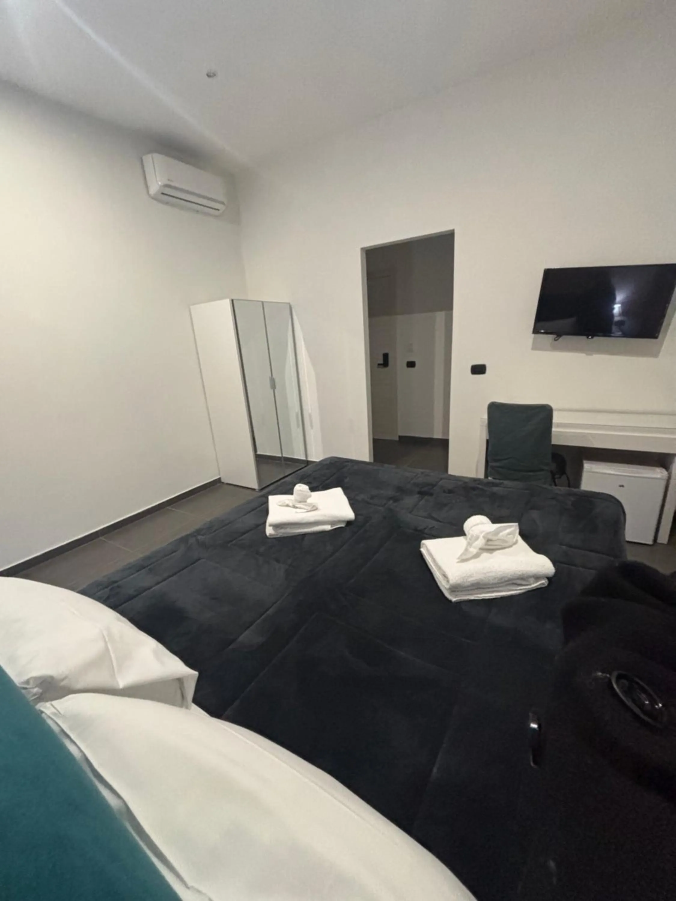 Bed in Doria Suites Napoli