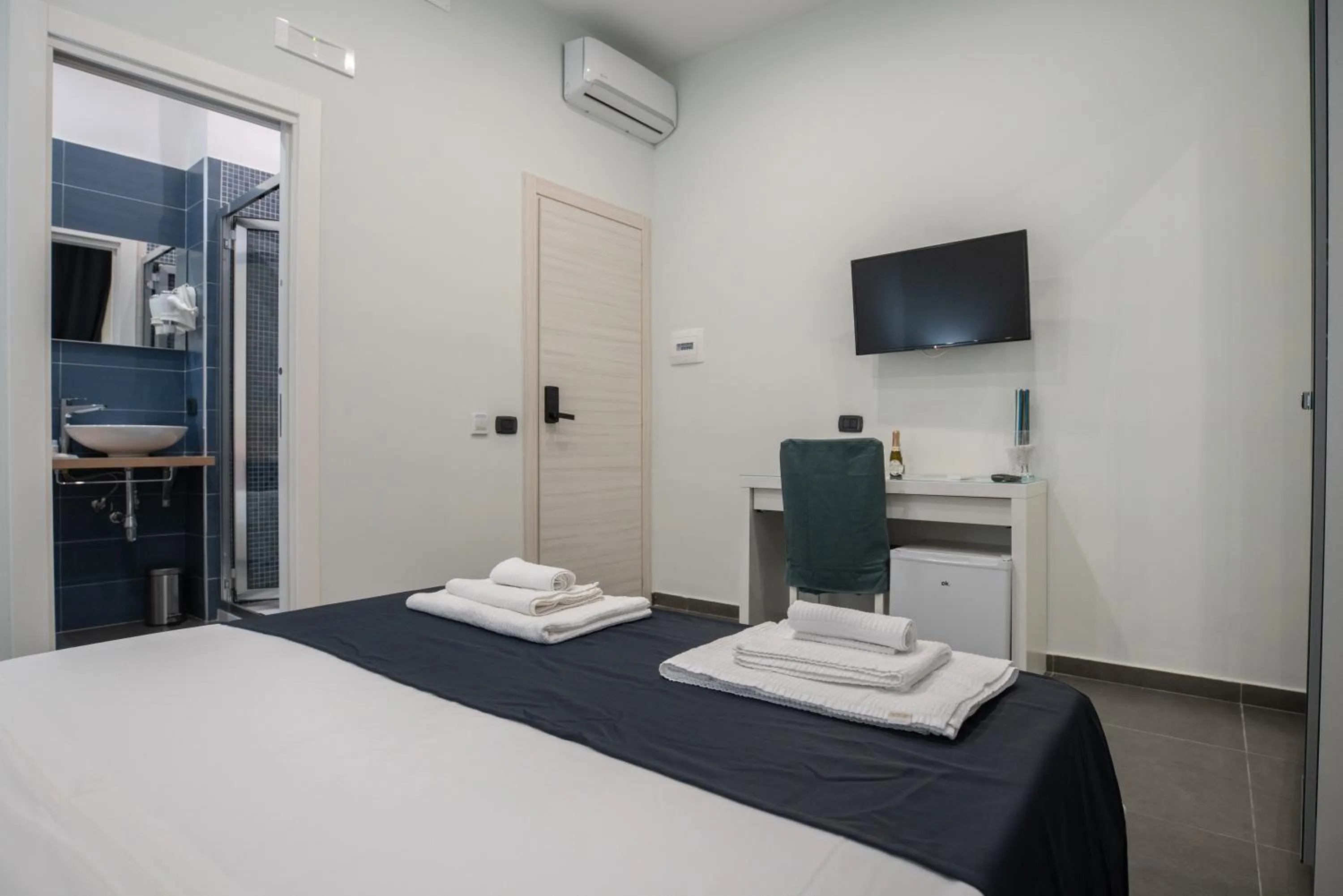 Bed in Doria Suites Napoli