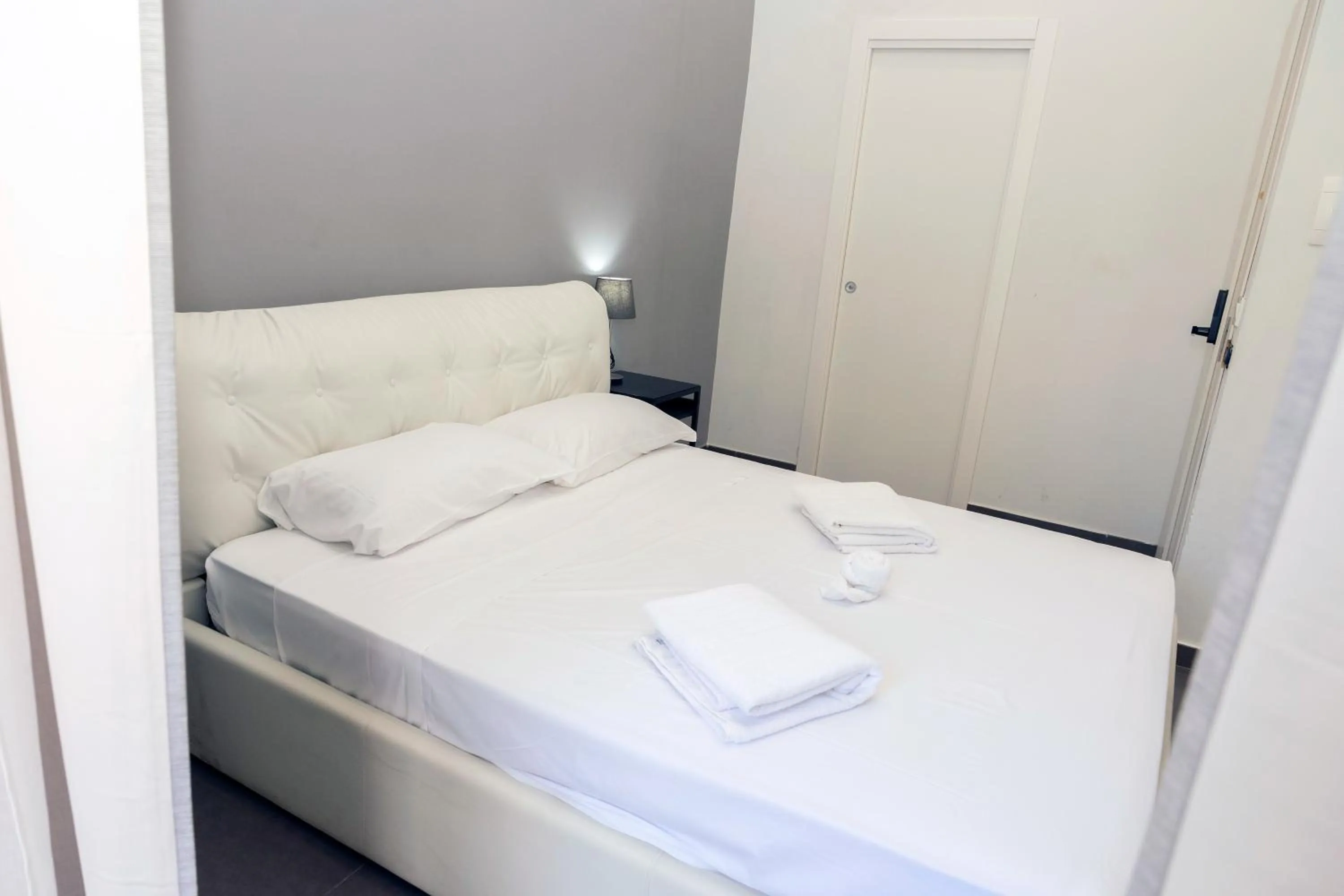 Bed in Doria Suites Napoli