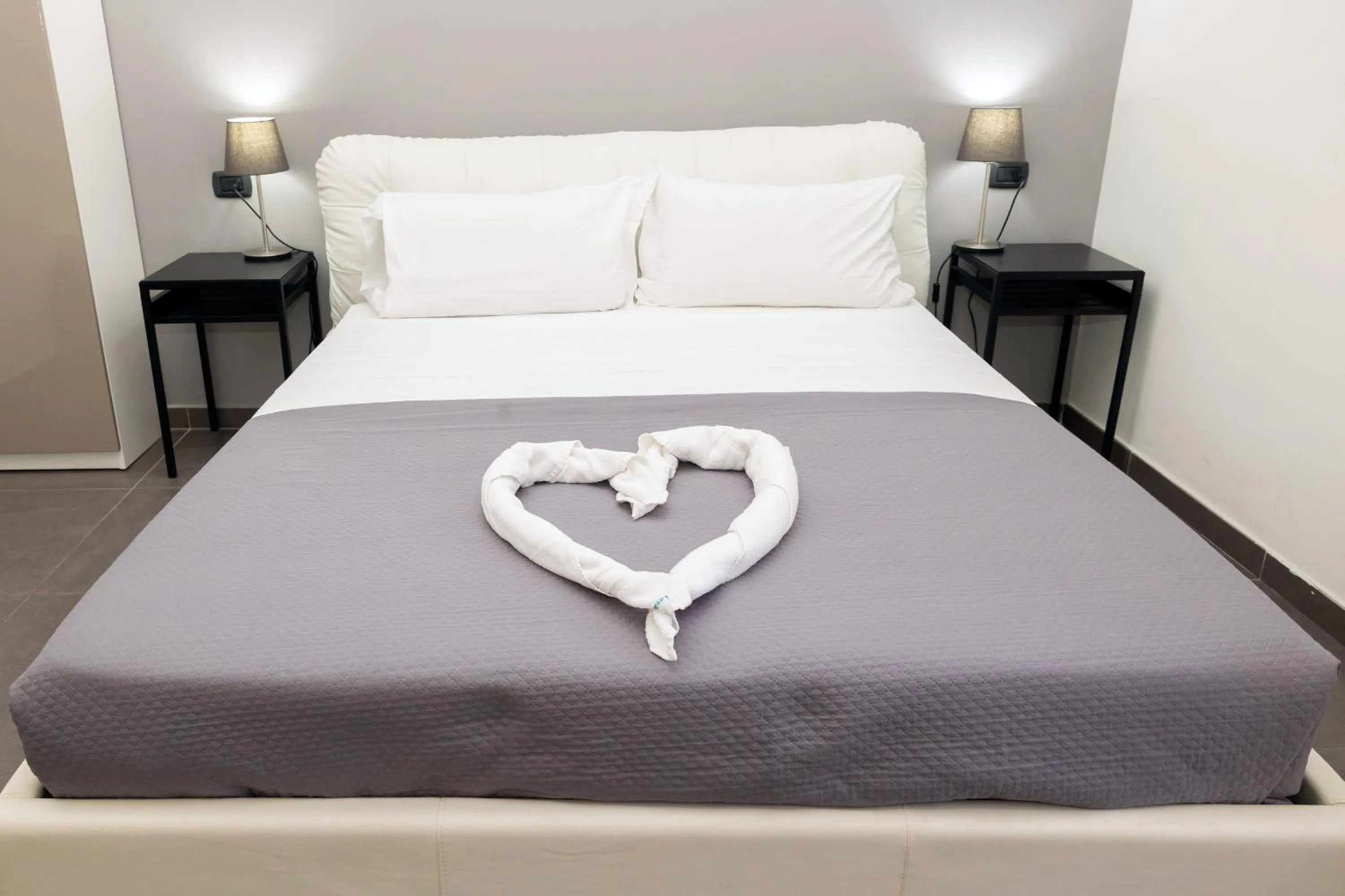 Bed in Doria Suites Napoli