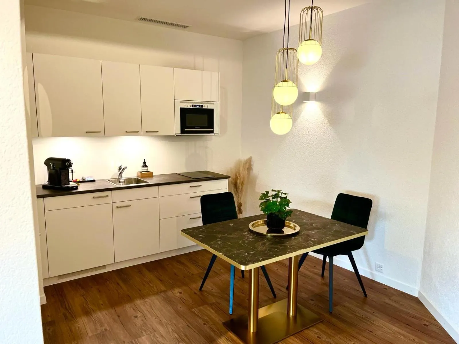 Kitchen or kitchenette in Apart-Hôtel Pont-de-Thielle