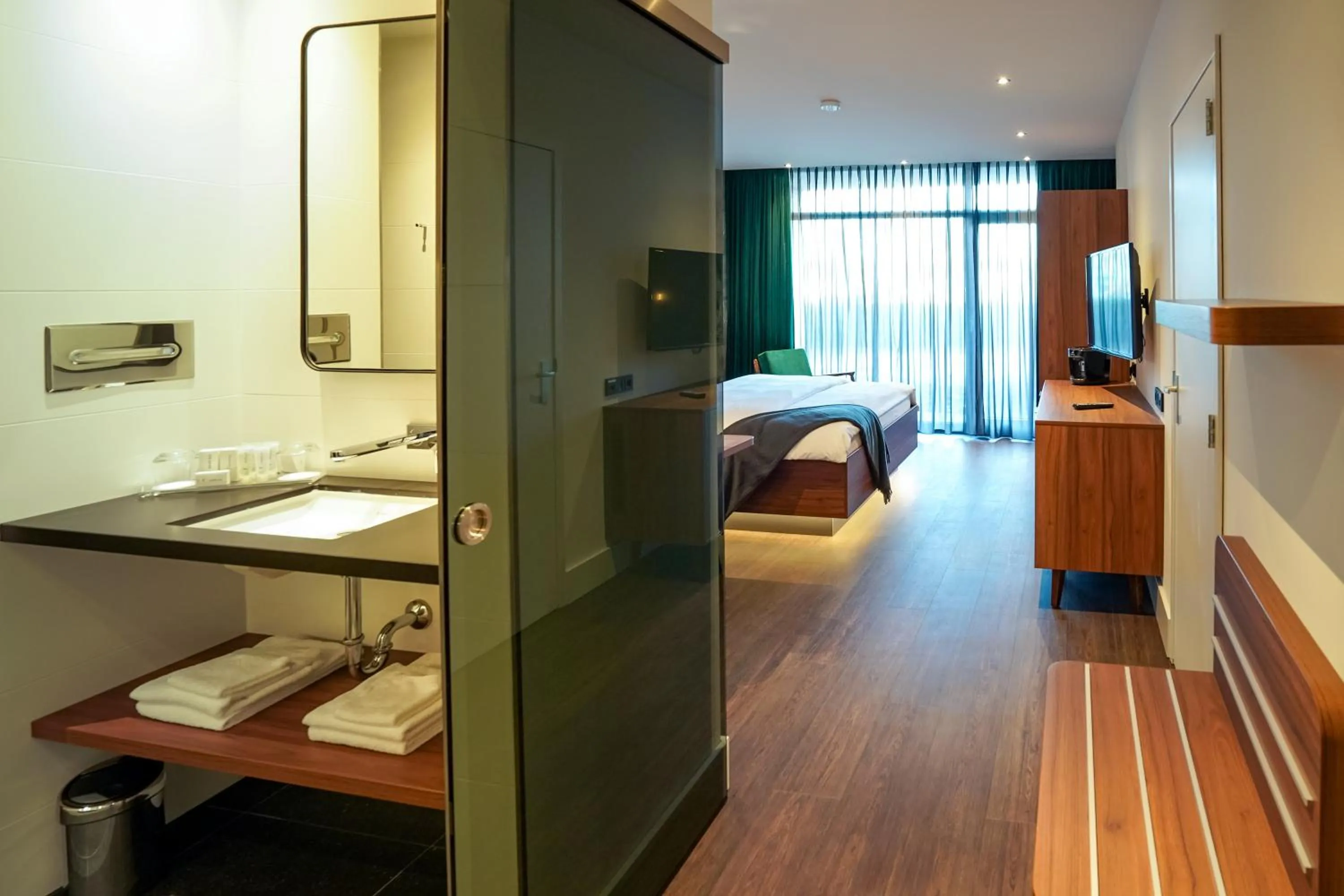 Bathroom, Bed in Van der Valk Hotel Berlin Brandenburg