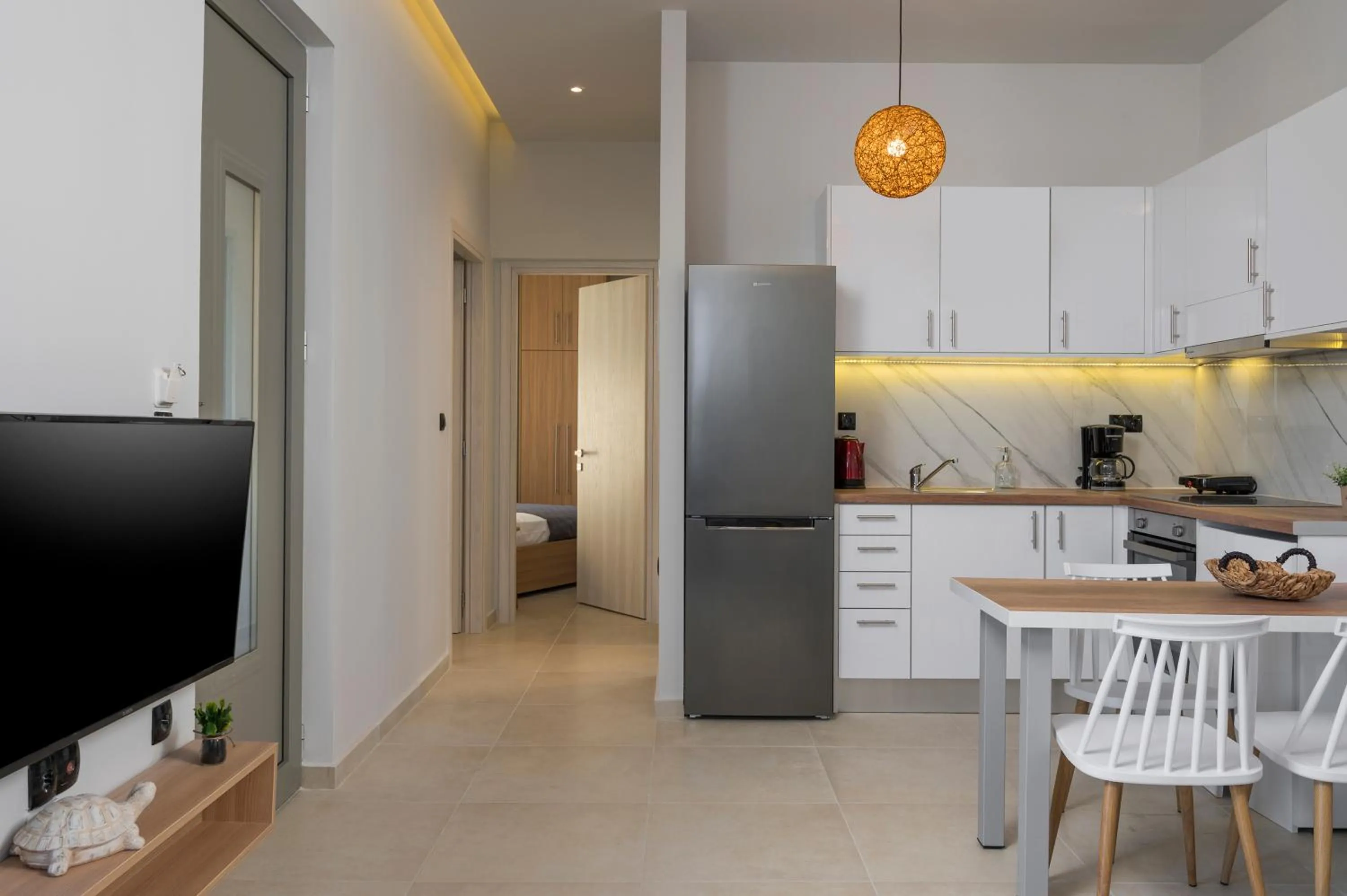 Dining area in Aegean Breeze Luxury Apartments next to the sea