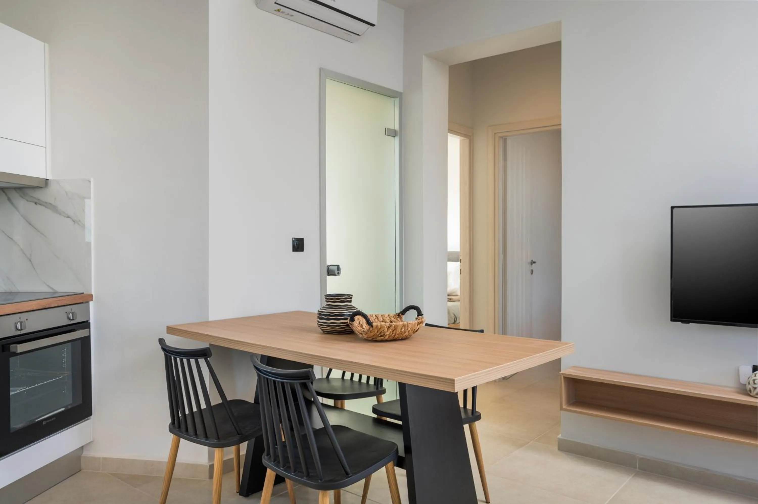 Dining area in Aegean Breeze Luxury Apartments next to the sea