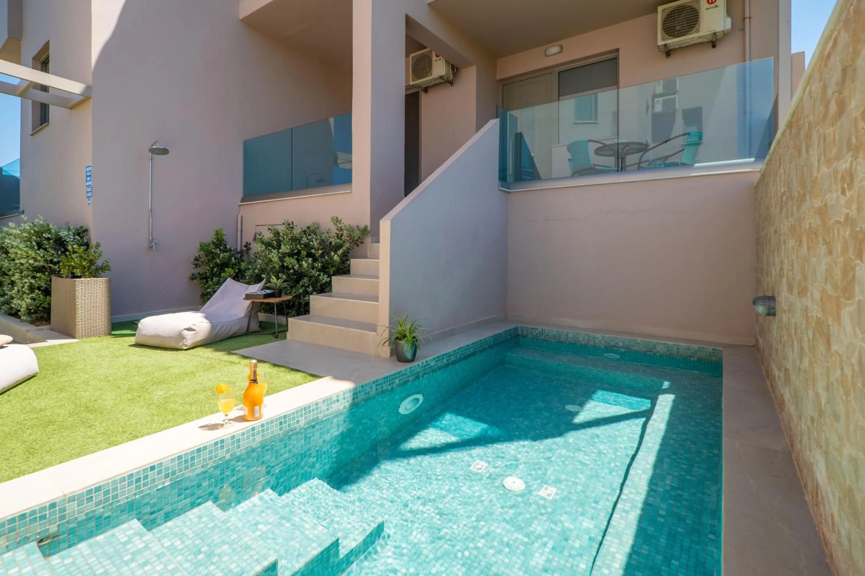 Pool view in Aegean Breeze Luxury Apartments next to the sea