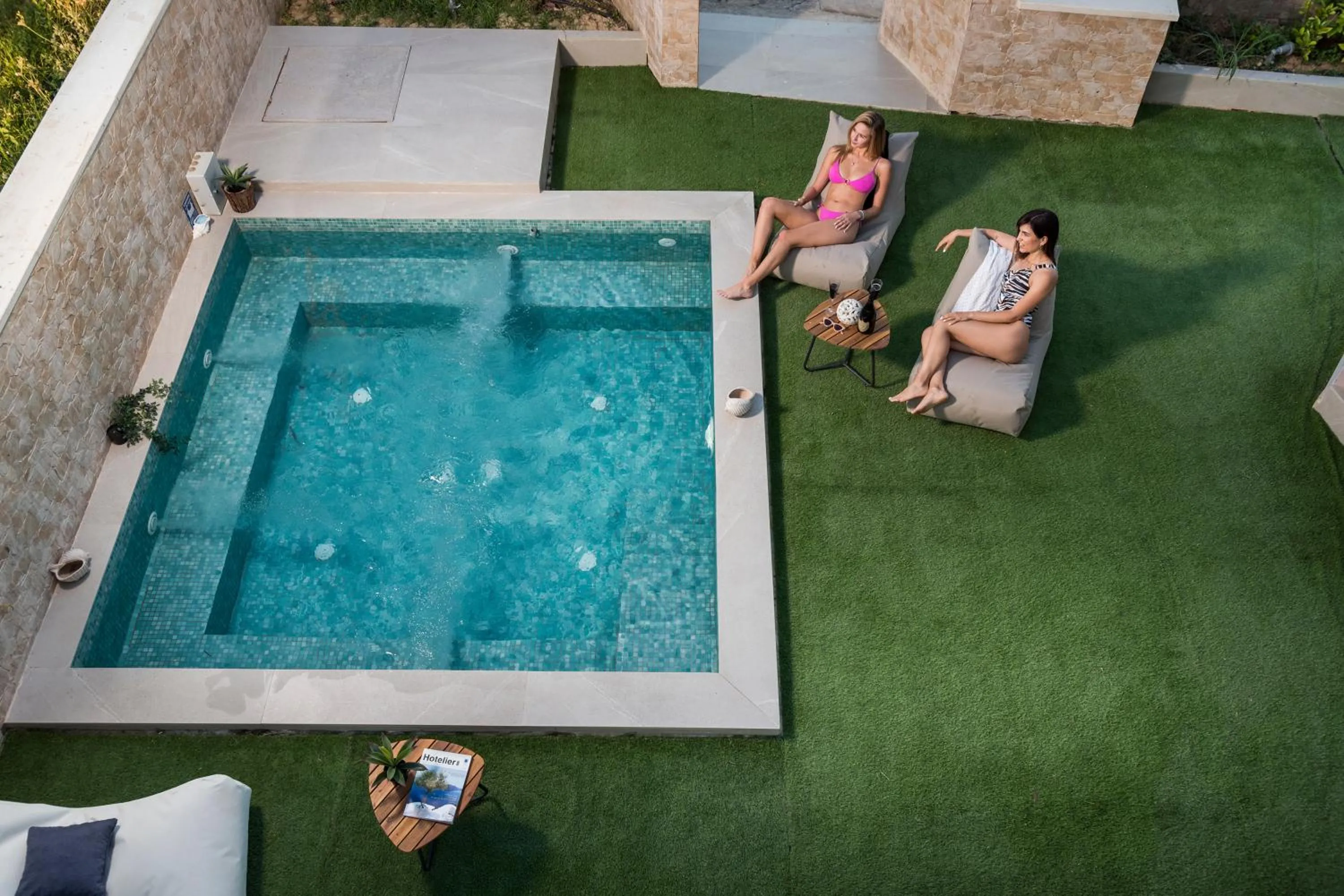 Pool view in Aegean Breeze Luxury Apartments next to the sea