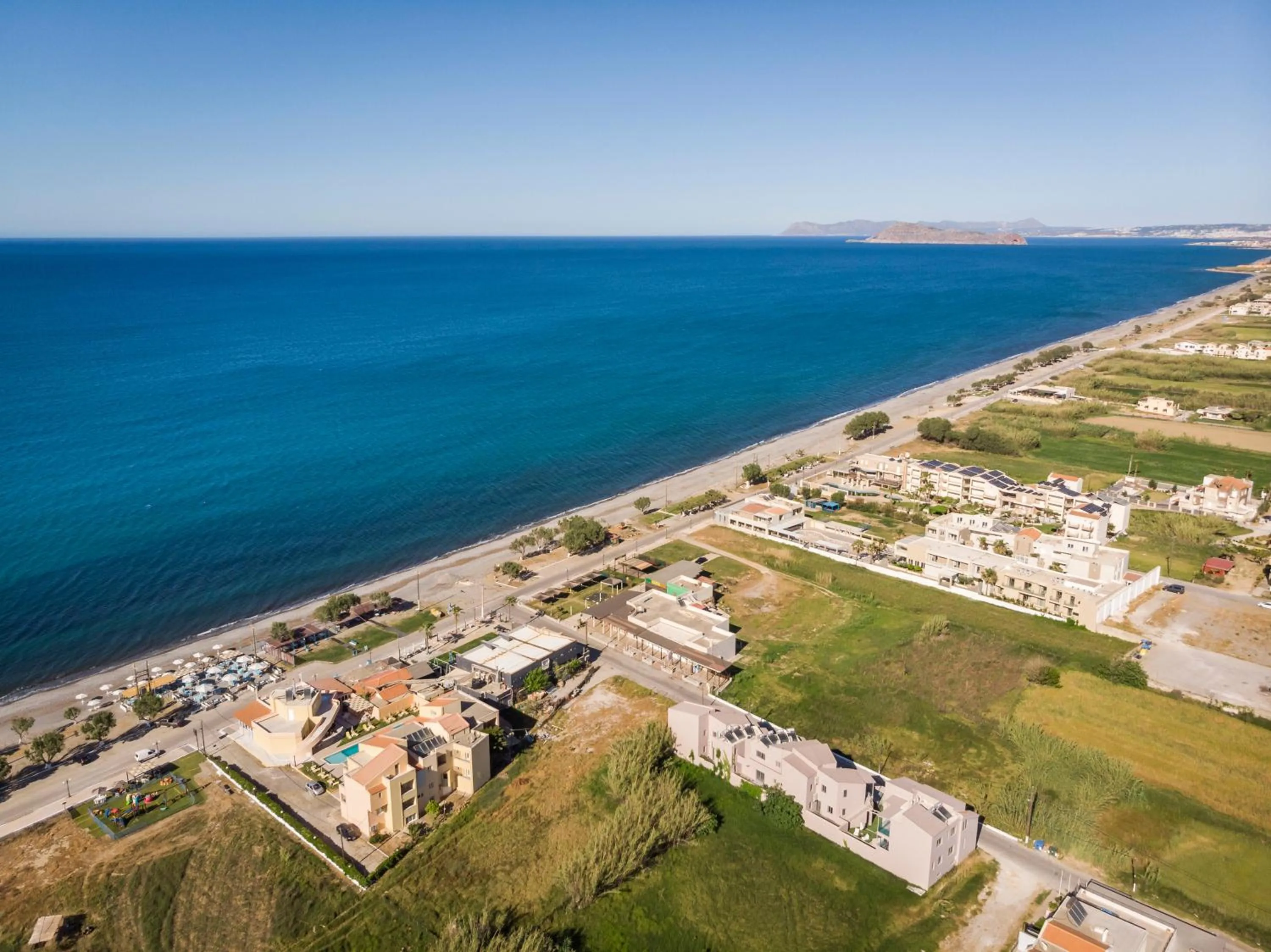 Property building in Aegean Breeze Luxury Apartments next to the sea