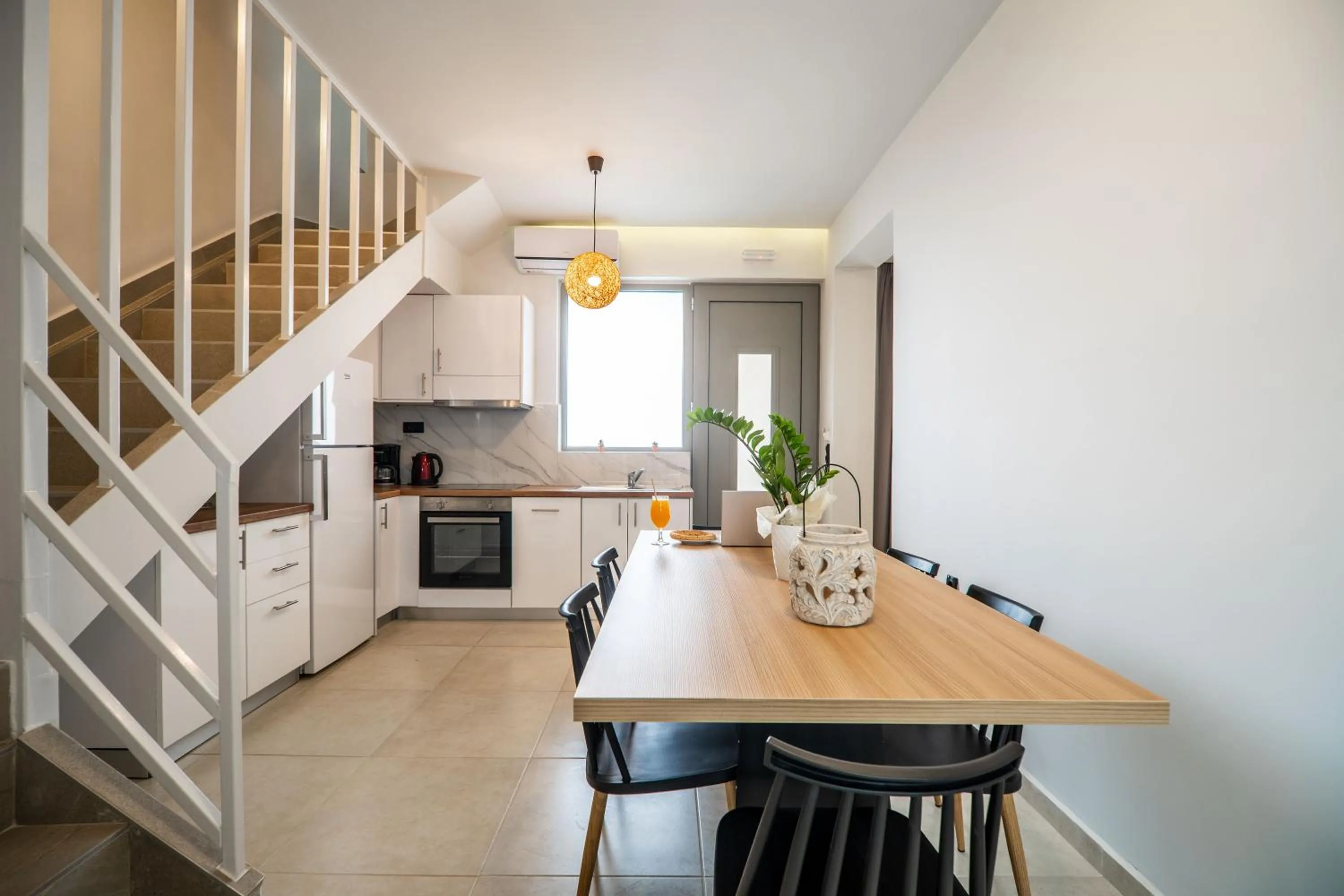 Kitchen or kitchenette in Aegean Breeze Luxury Apartments next to the sea