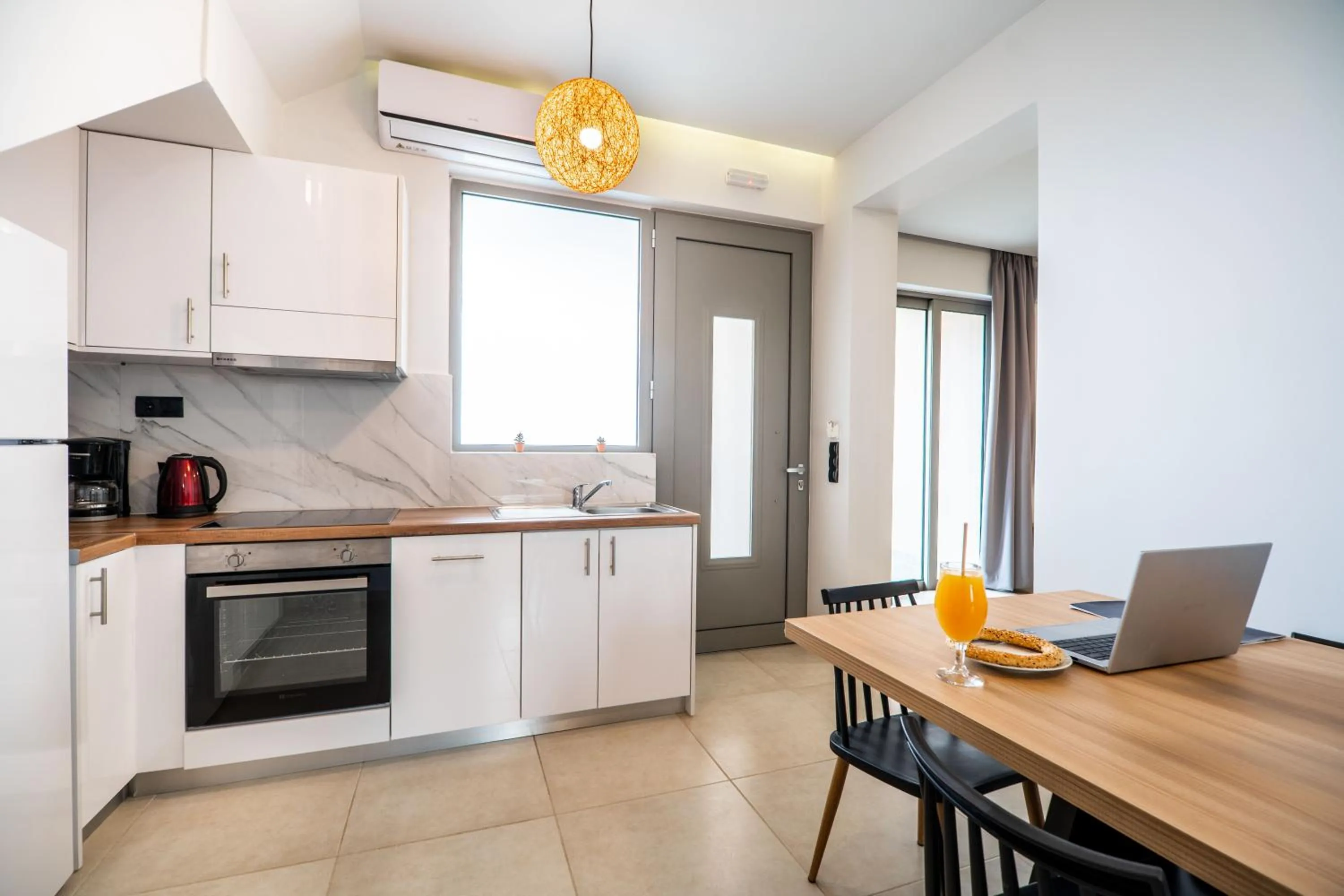 Kitchen or kitchenette in Aegean Breeze Luxury Apartments next to the sea
