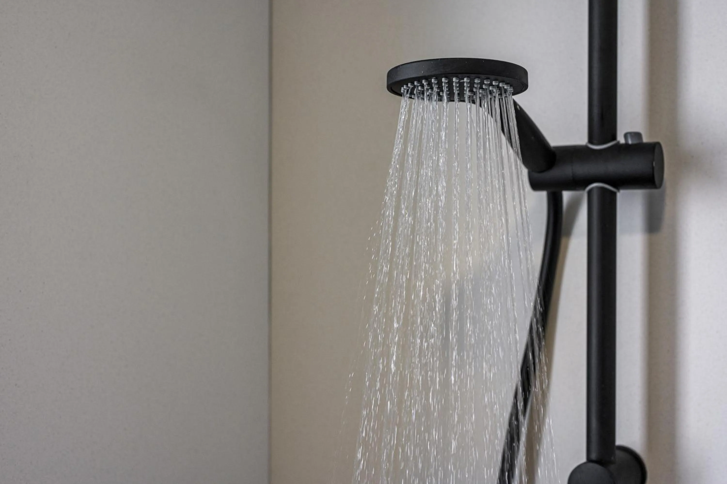 Shower in Aegean Breeze Luxury Apartments next to the sea