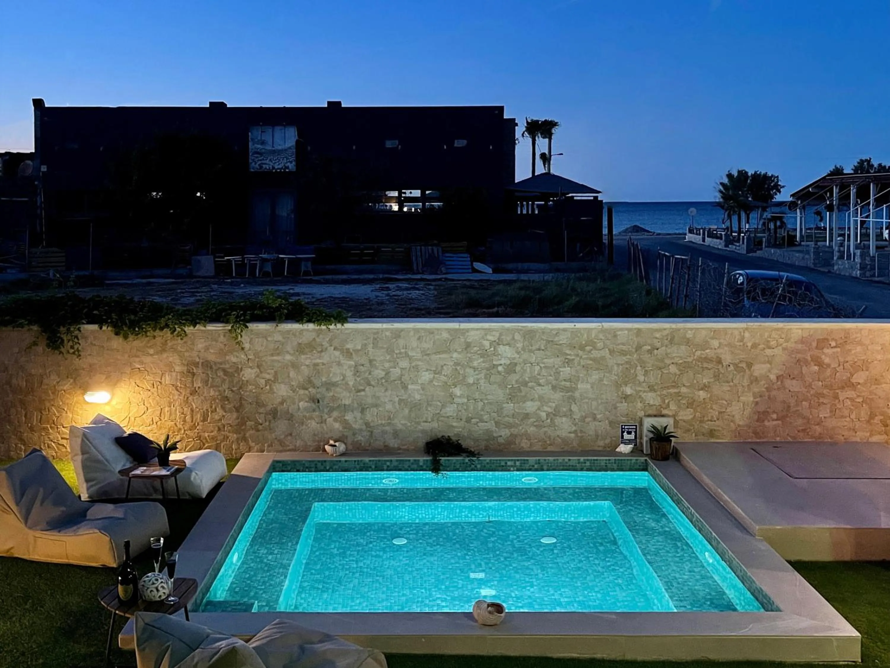 Swimming pool in Aegean Breeze Luxury Apartments next to the sea