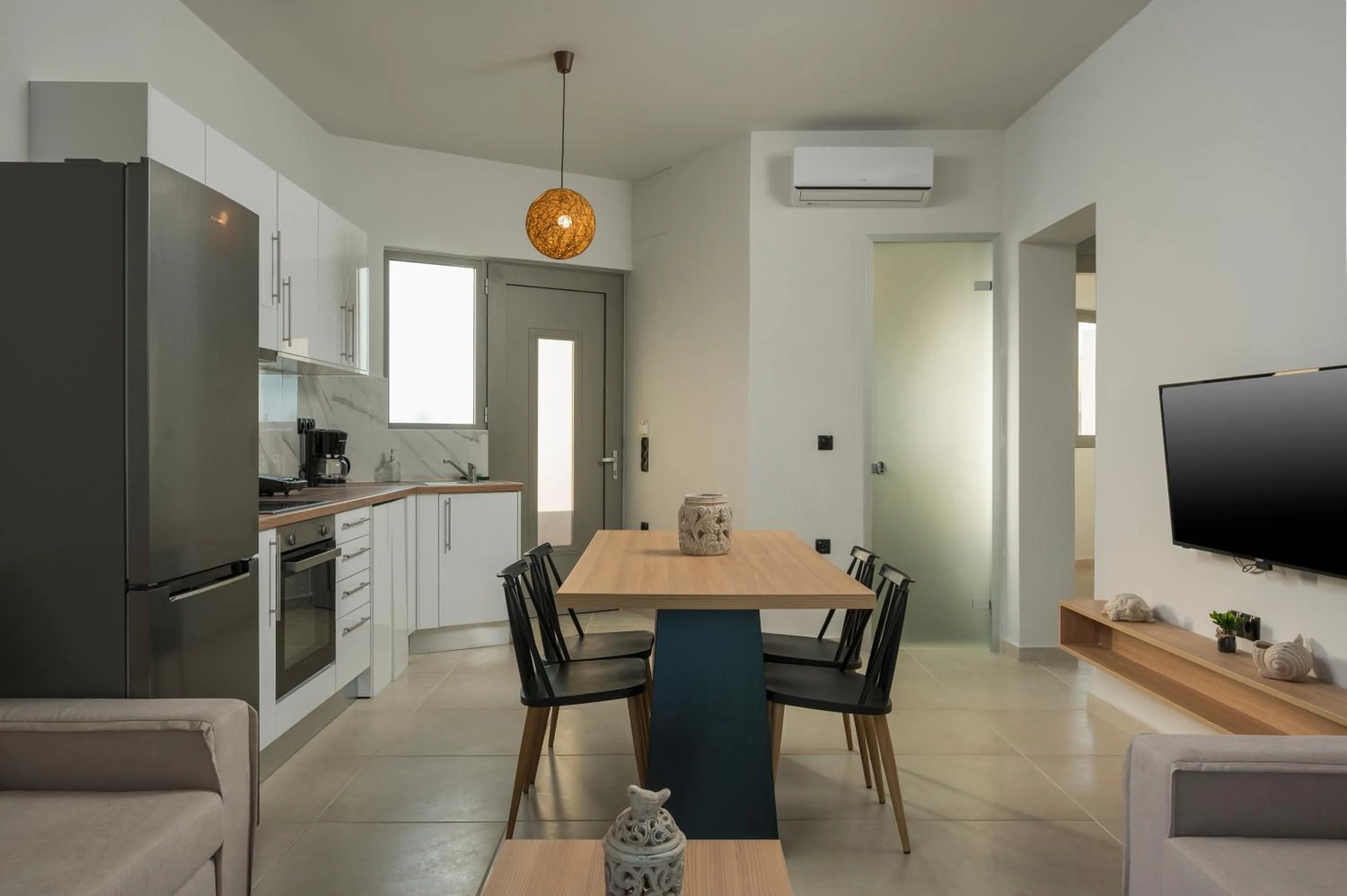 Kitchen or kitchenette in Aegean Breeze Luxury Apartments next to the sea