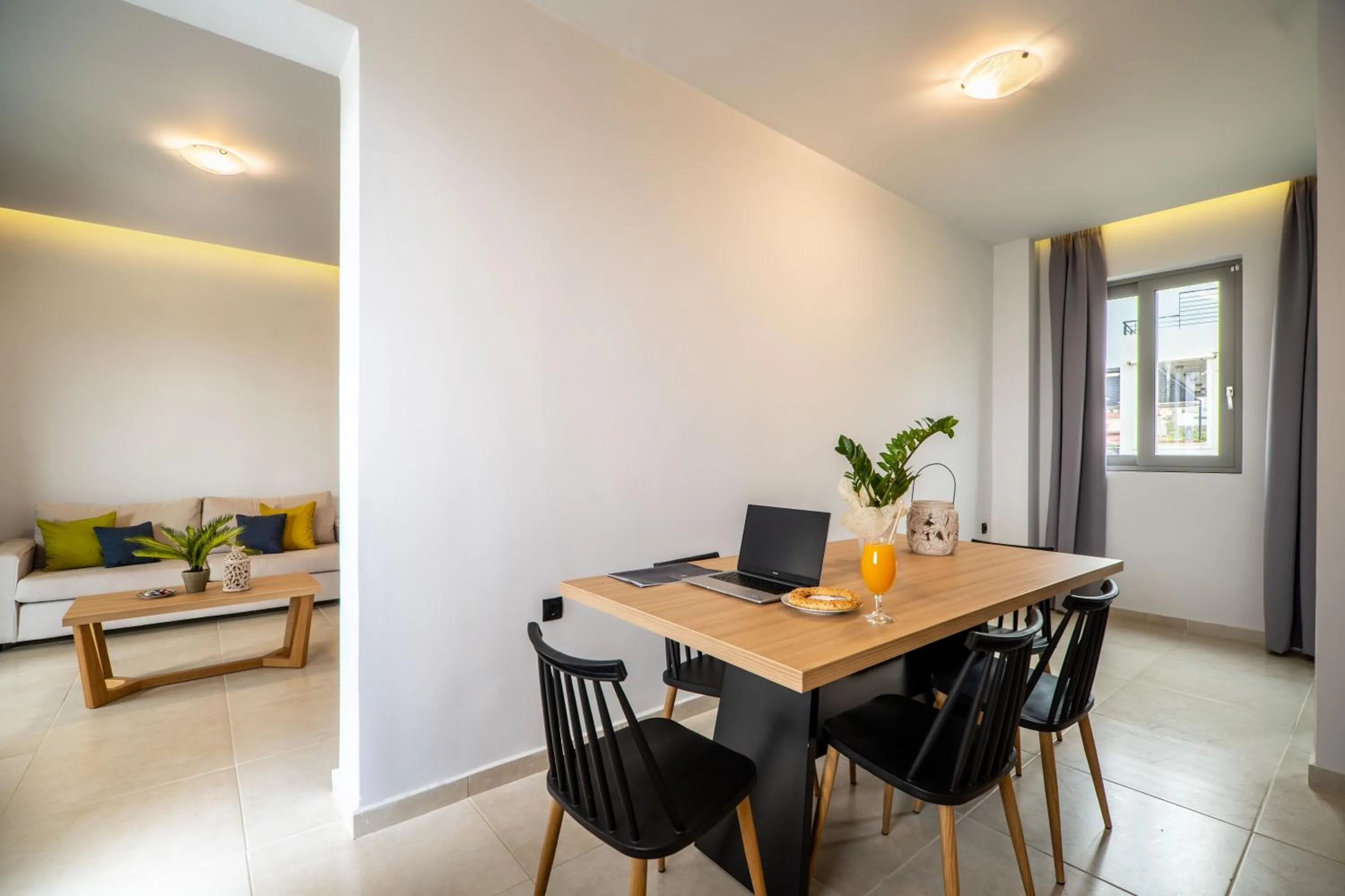 Dining area in Aegean Breeze Luxury Apartments next to the sea