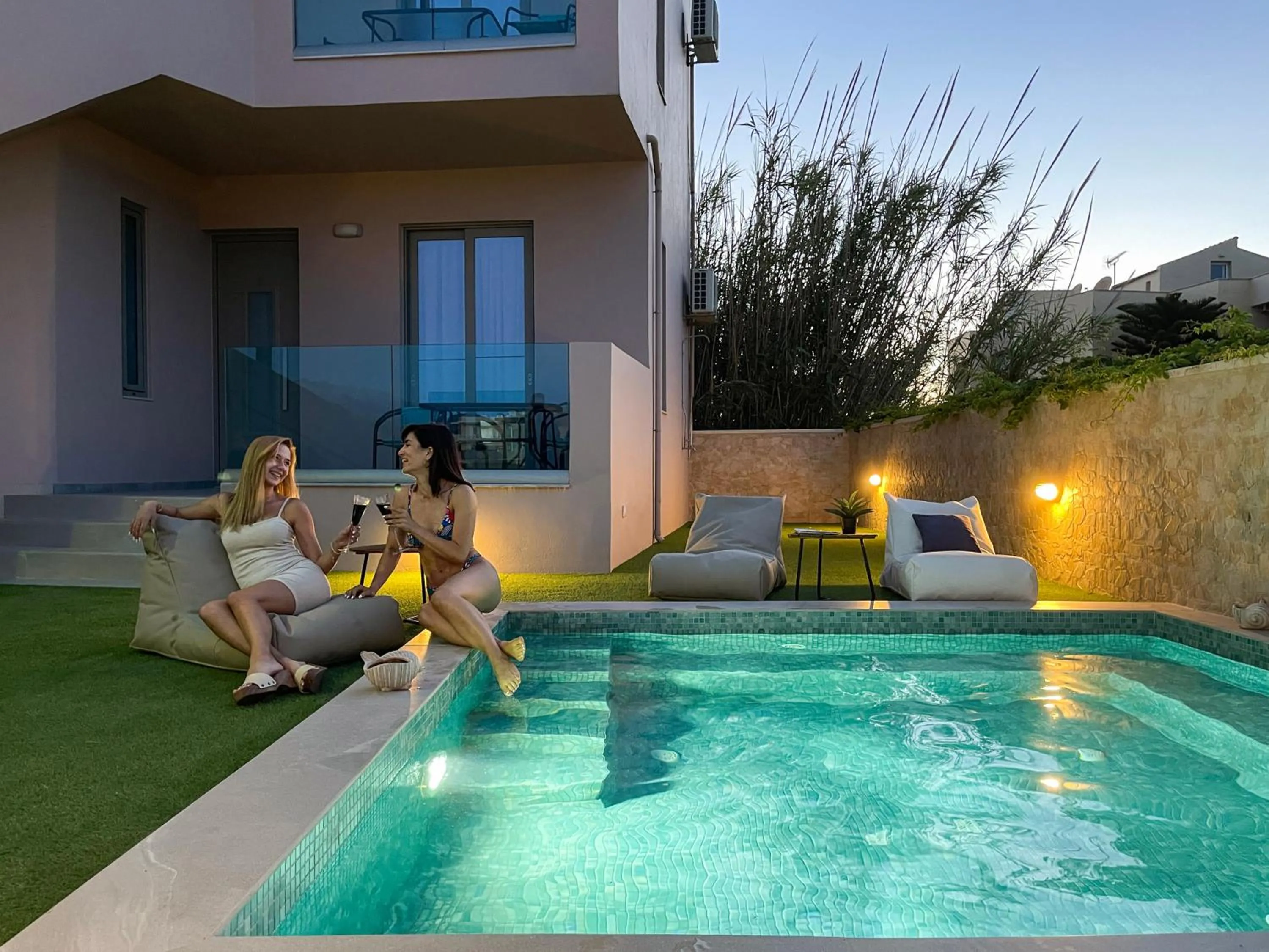 Swimming pool in Aegean Breeze Luxury Apartments next to the sea