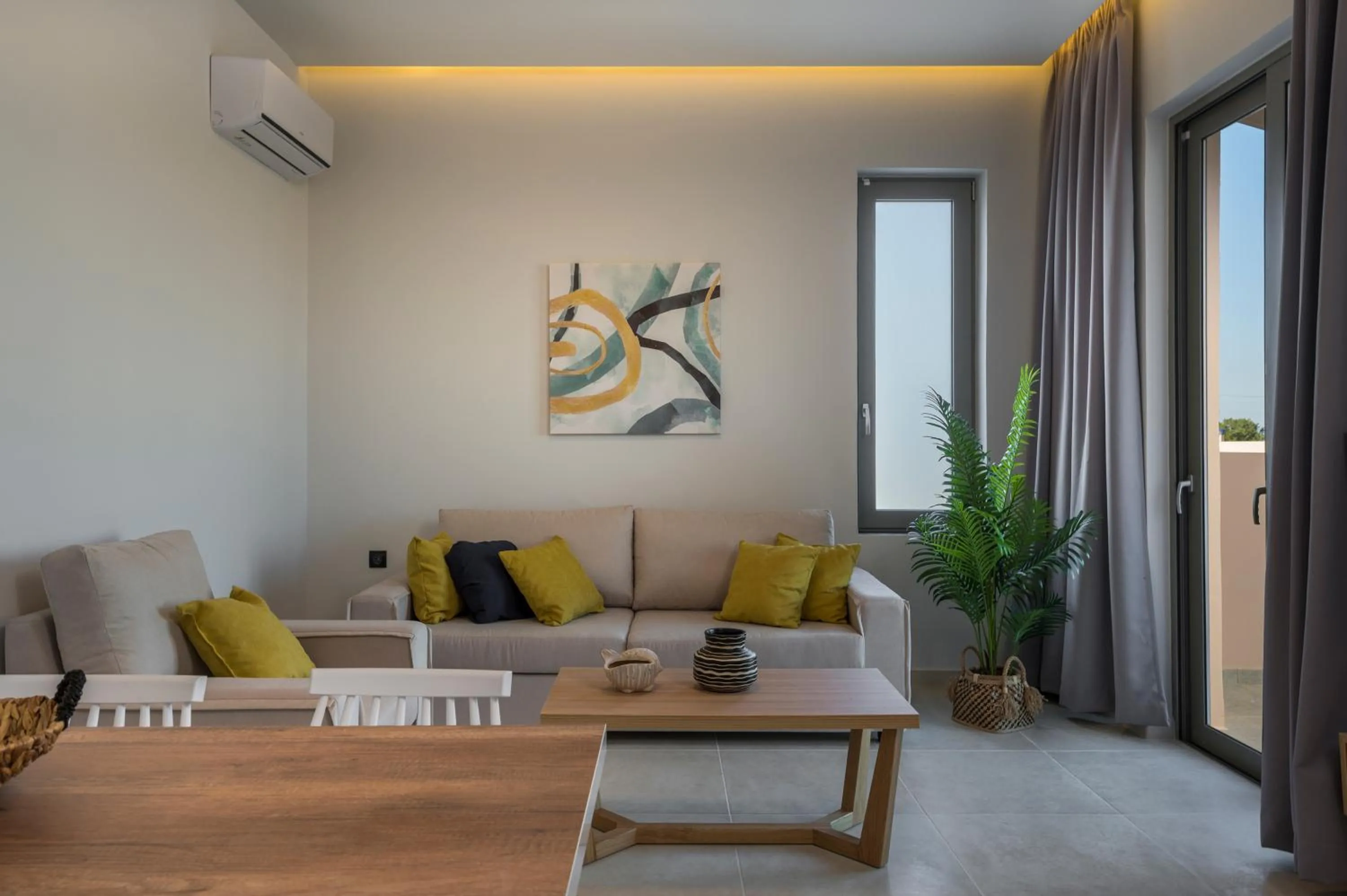 Living room in Aegean Breeze Luxury Apartments next to the sea
