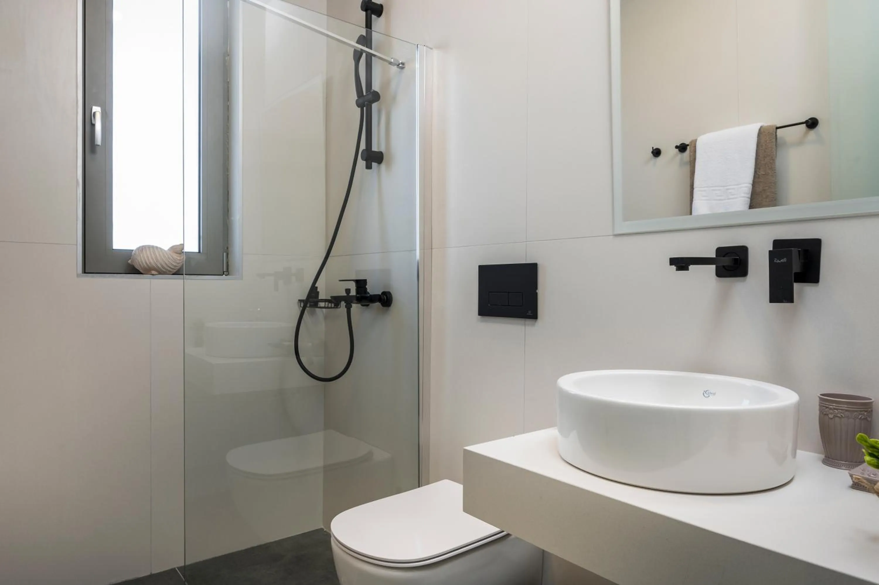 Bathroom in Aegean Breeze Luxury Apartments next to the sea