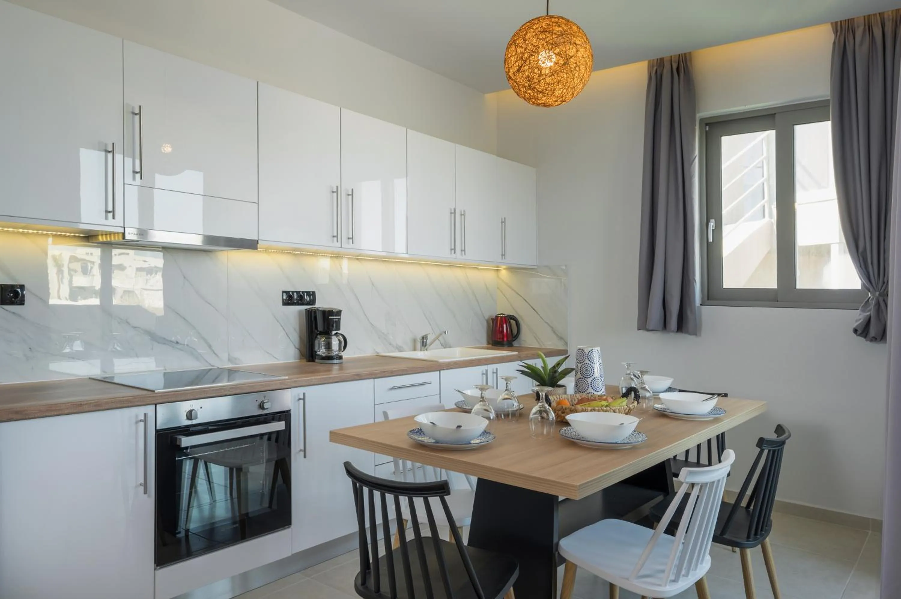 Kitchen or kitchenette in Aegean Breeze Luxury Apartments next to the sea