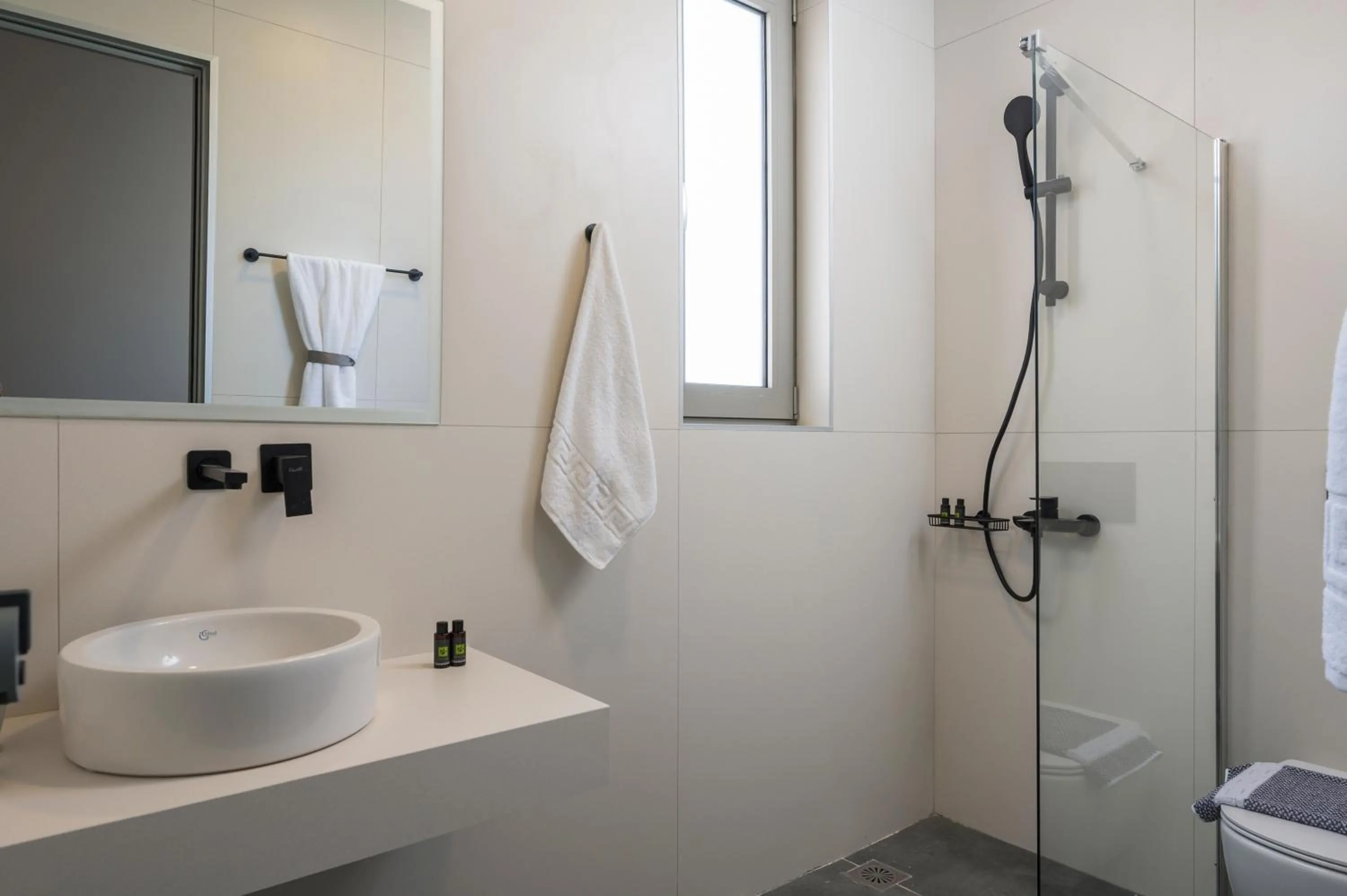 Bathroom in Aegean Breeze Luxury Apartments next to the sea