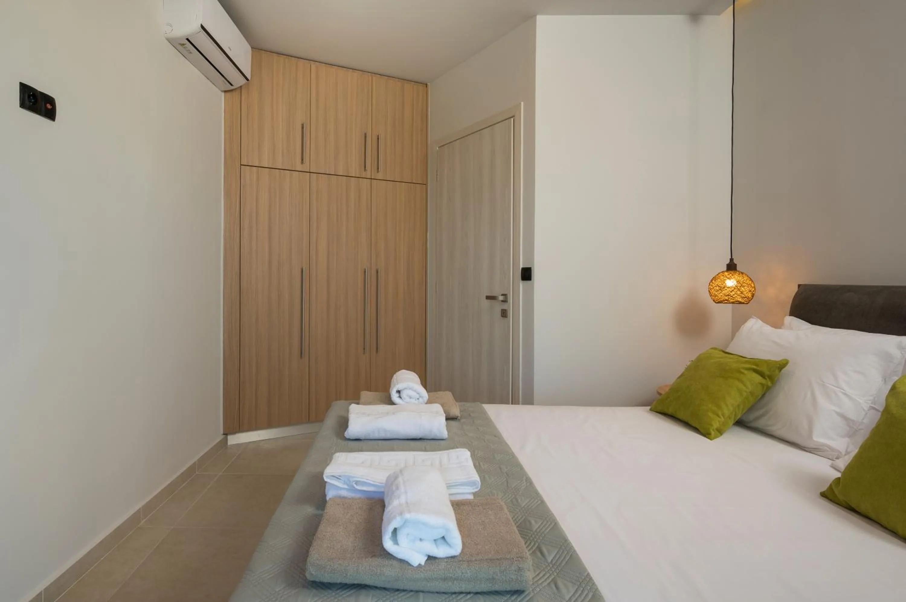Bedroom, Bed in Aegean Breeze Luxury Apartments next to the sea