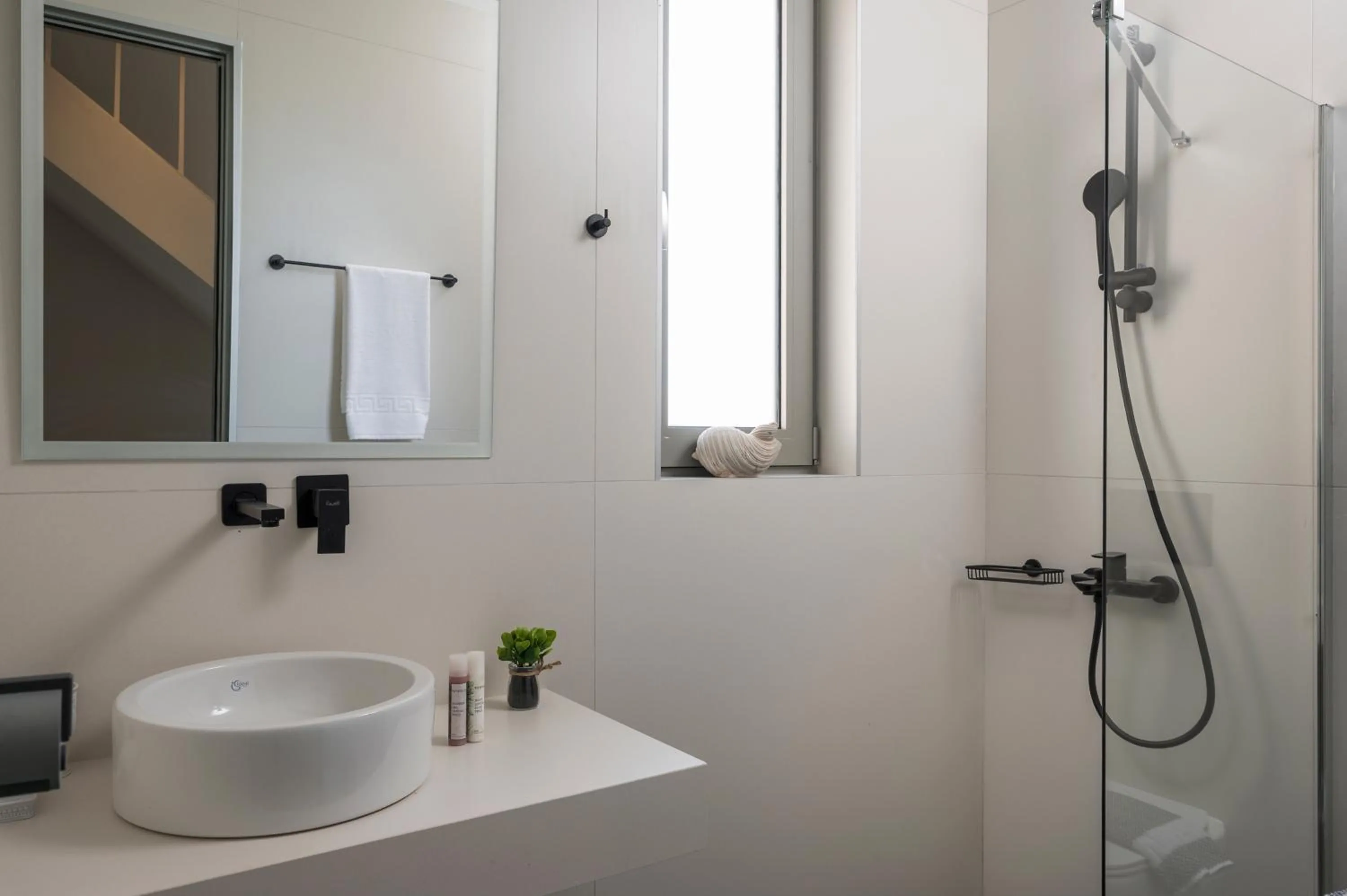 Bathroom in Aegean Breeze Luxury Apartments next to the sea