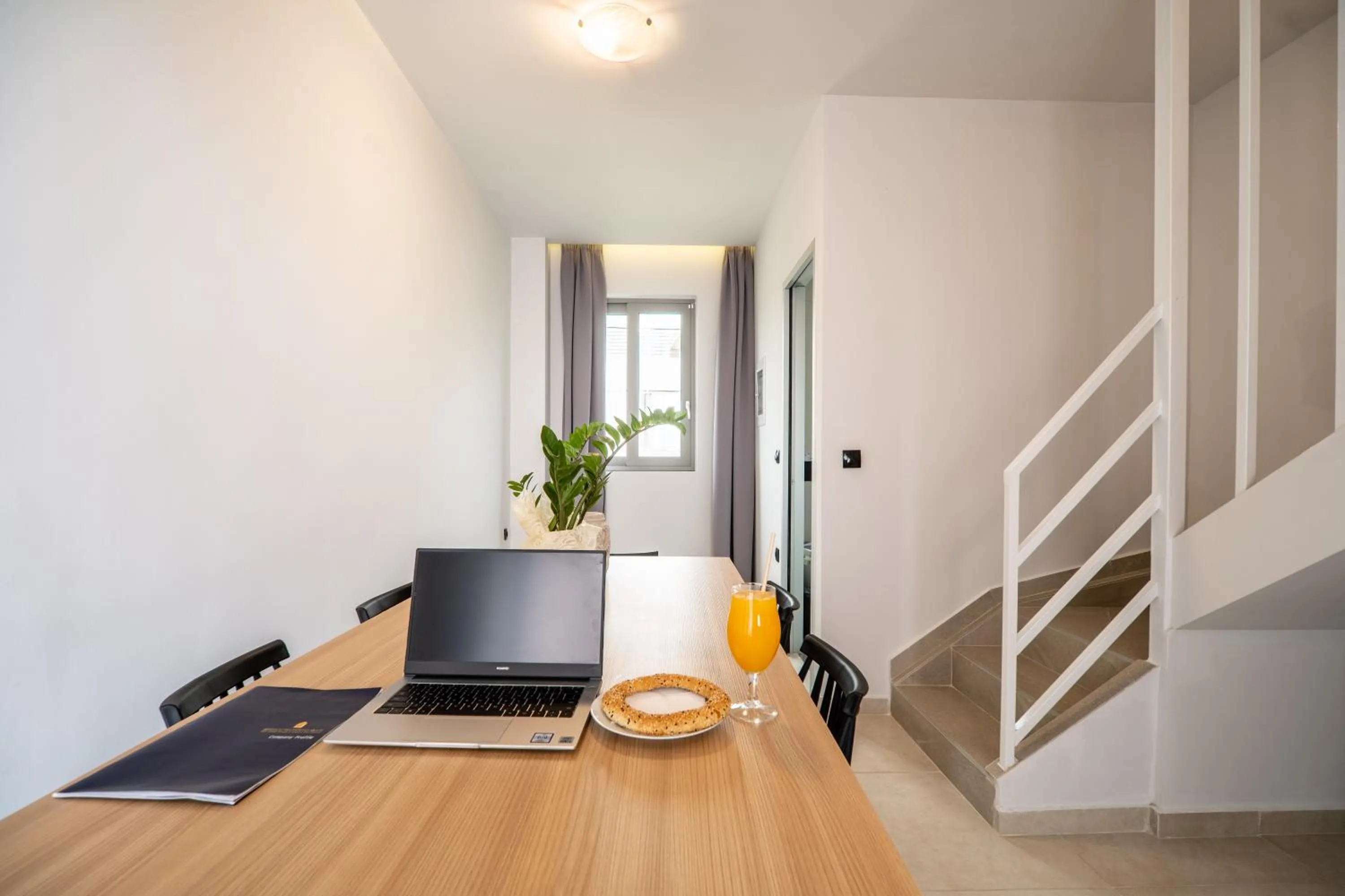 Dining area in Aegean Breeze Luxury Apartments next to the sea