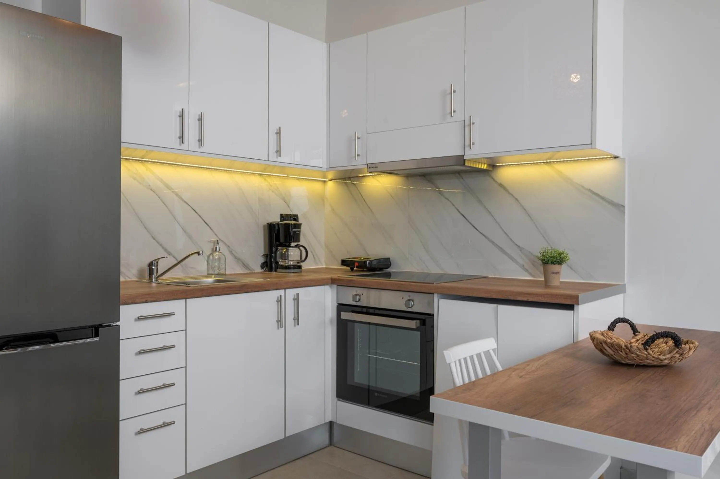 Kitchen or kitchenette in Aegean Breeze Luxury Apartments next to the sea