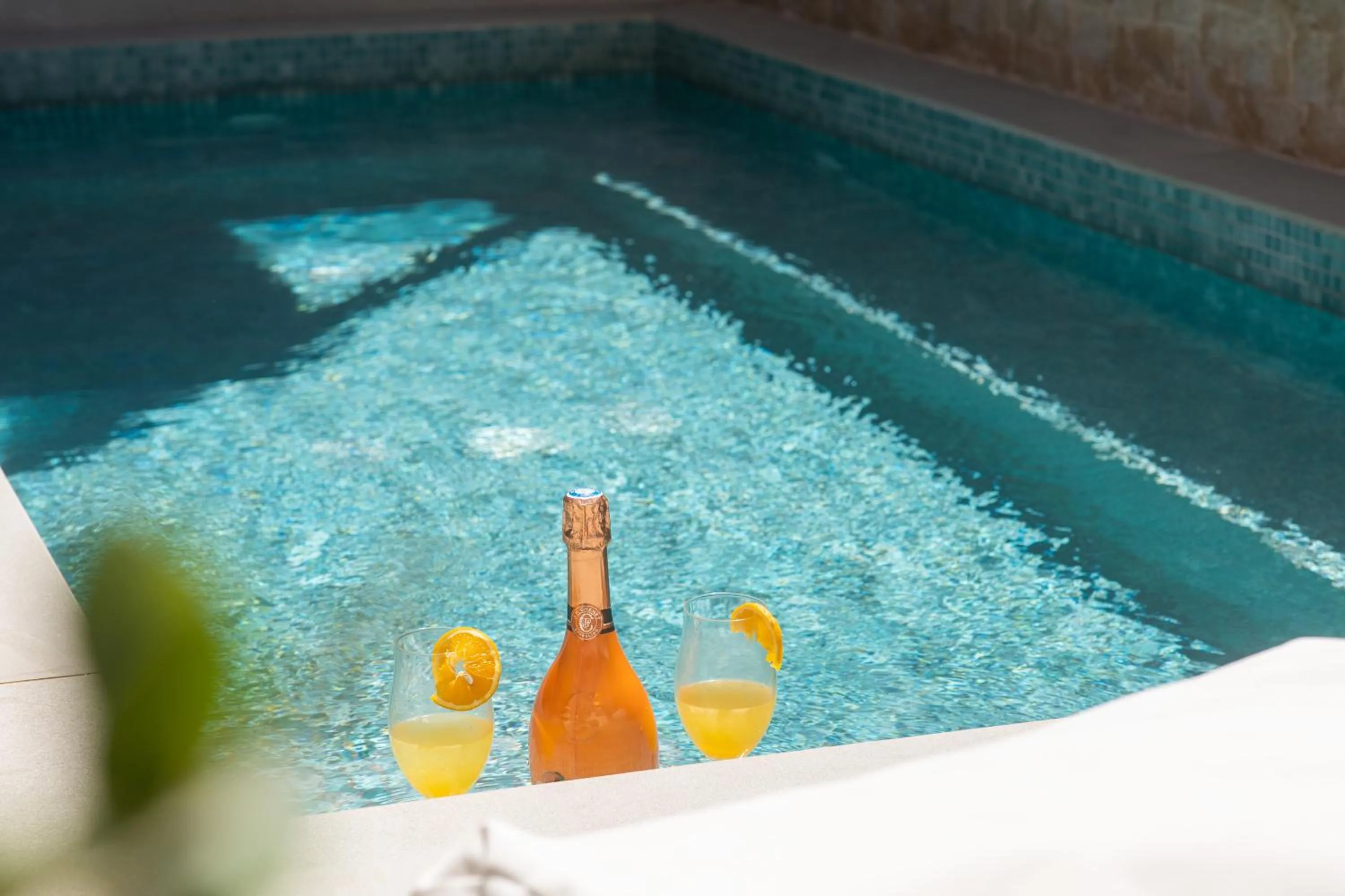 Swimming pool in Aegean Breeze Luxury Apartments next to the sea