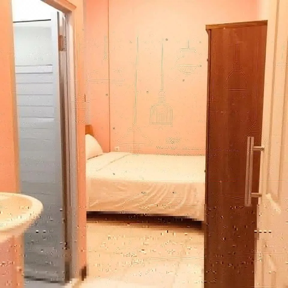 Bed in RoomZ Budget Residence