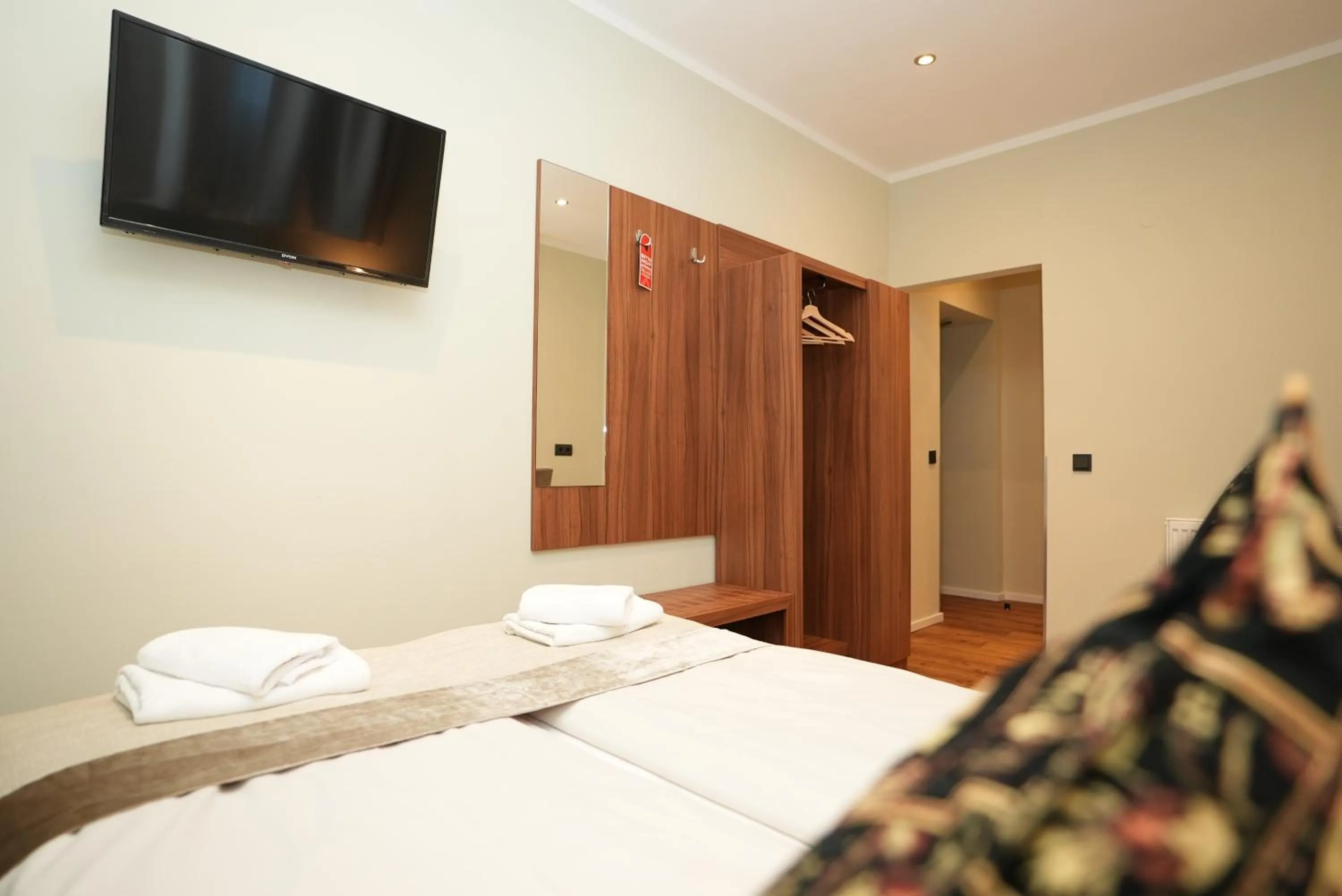 Bed in Hotel Attaché an der Messe