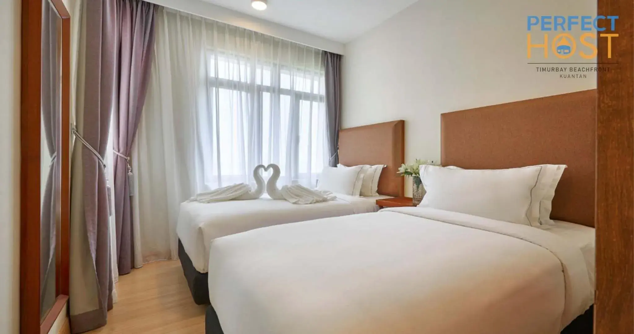 Bed in Timurbay Beachfront by Perfect Host Bed in Timurbay Beachfront by Perfect Host
