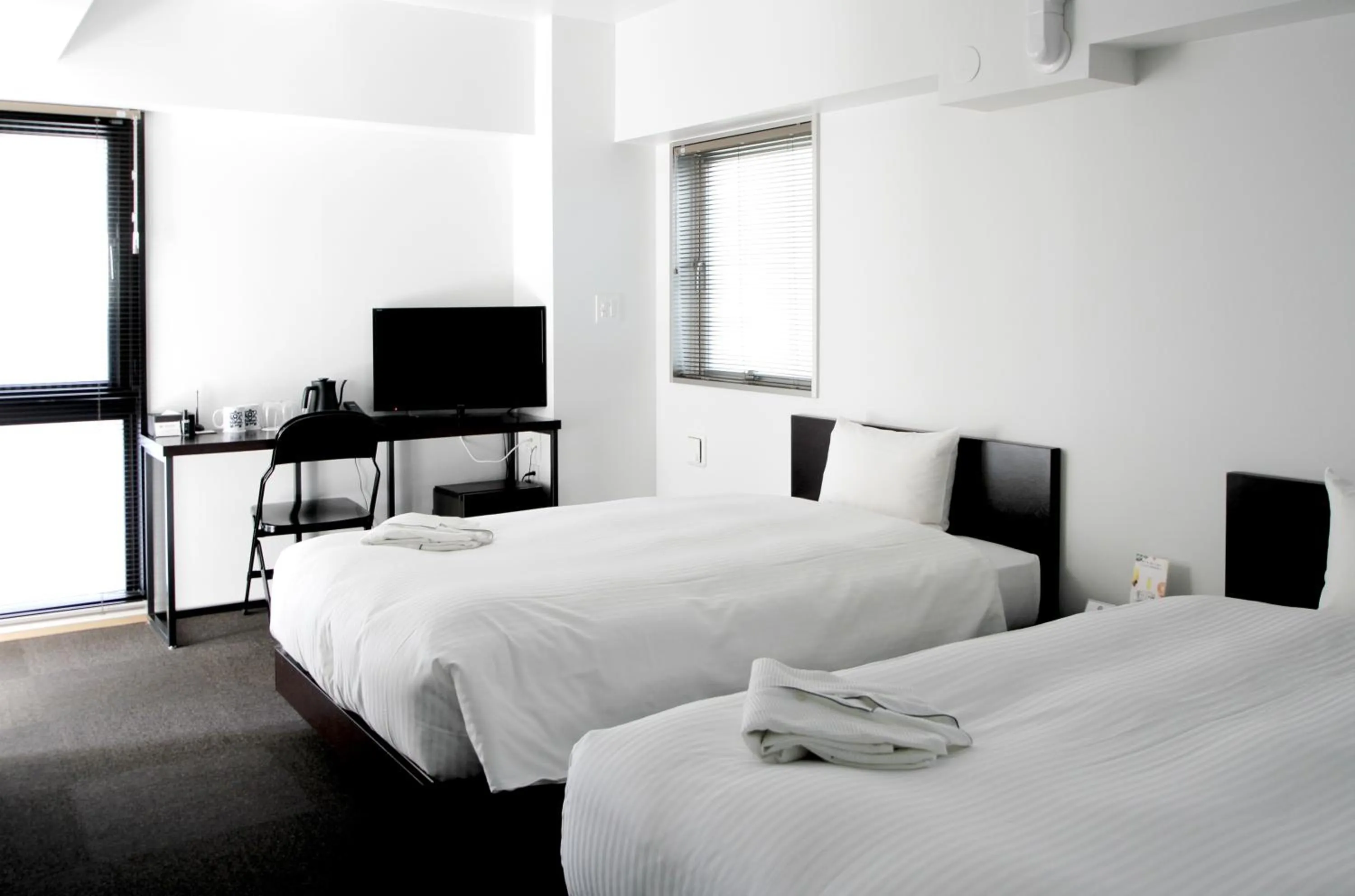 Bed in 8HOTEL Chigasaki