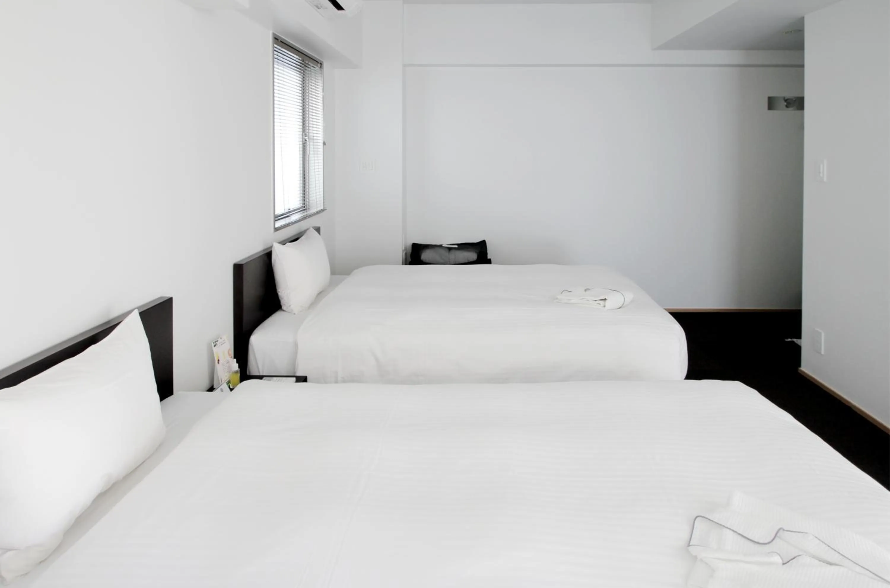 Bed in 8HOTEL Chigasaki