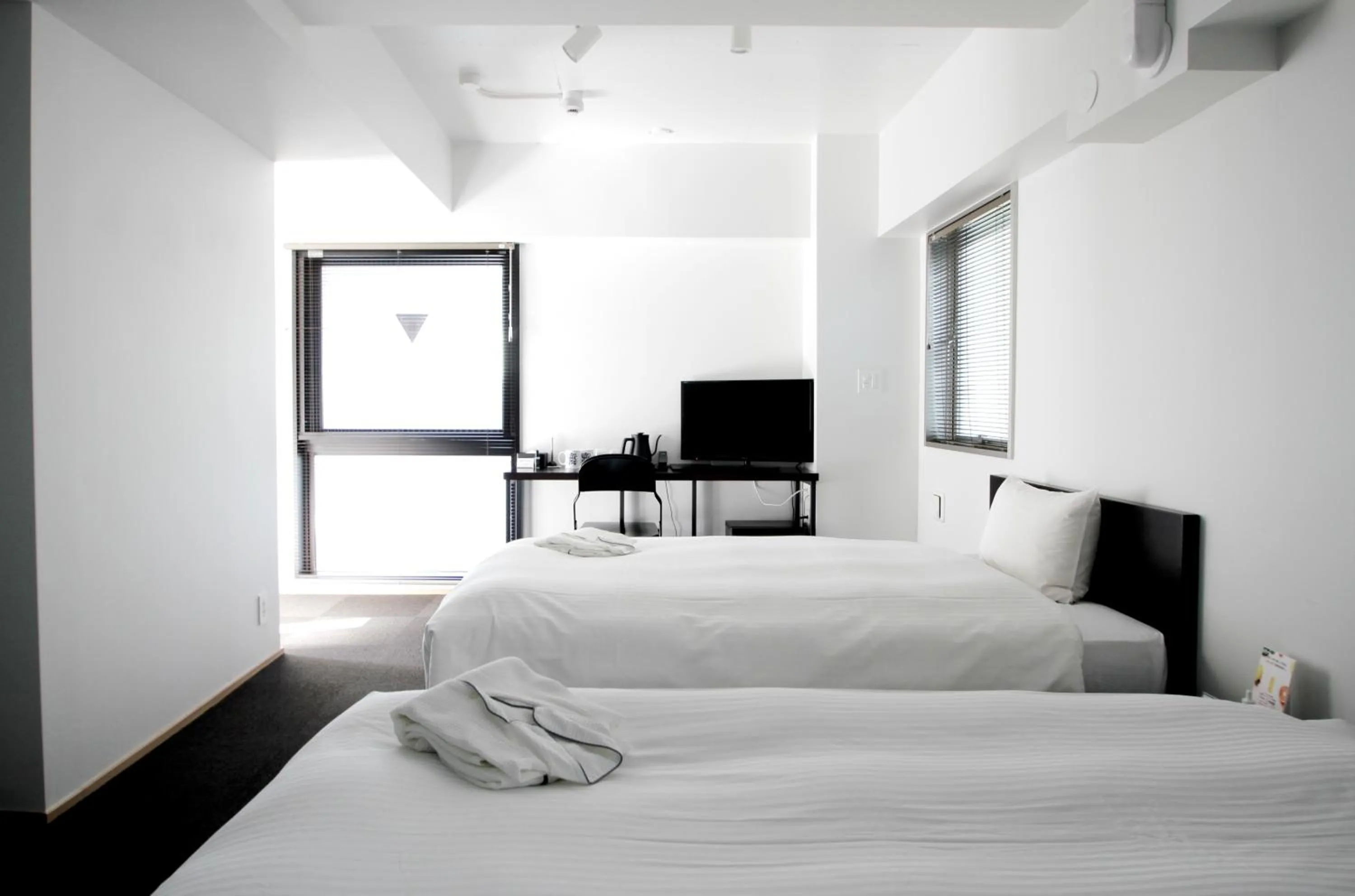 Bed in 8HOTEL Chigasaki