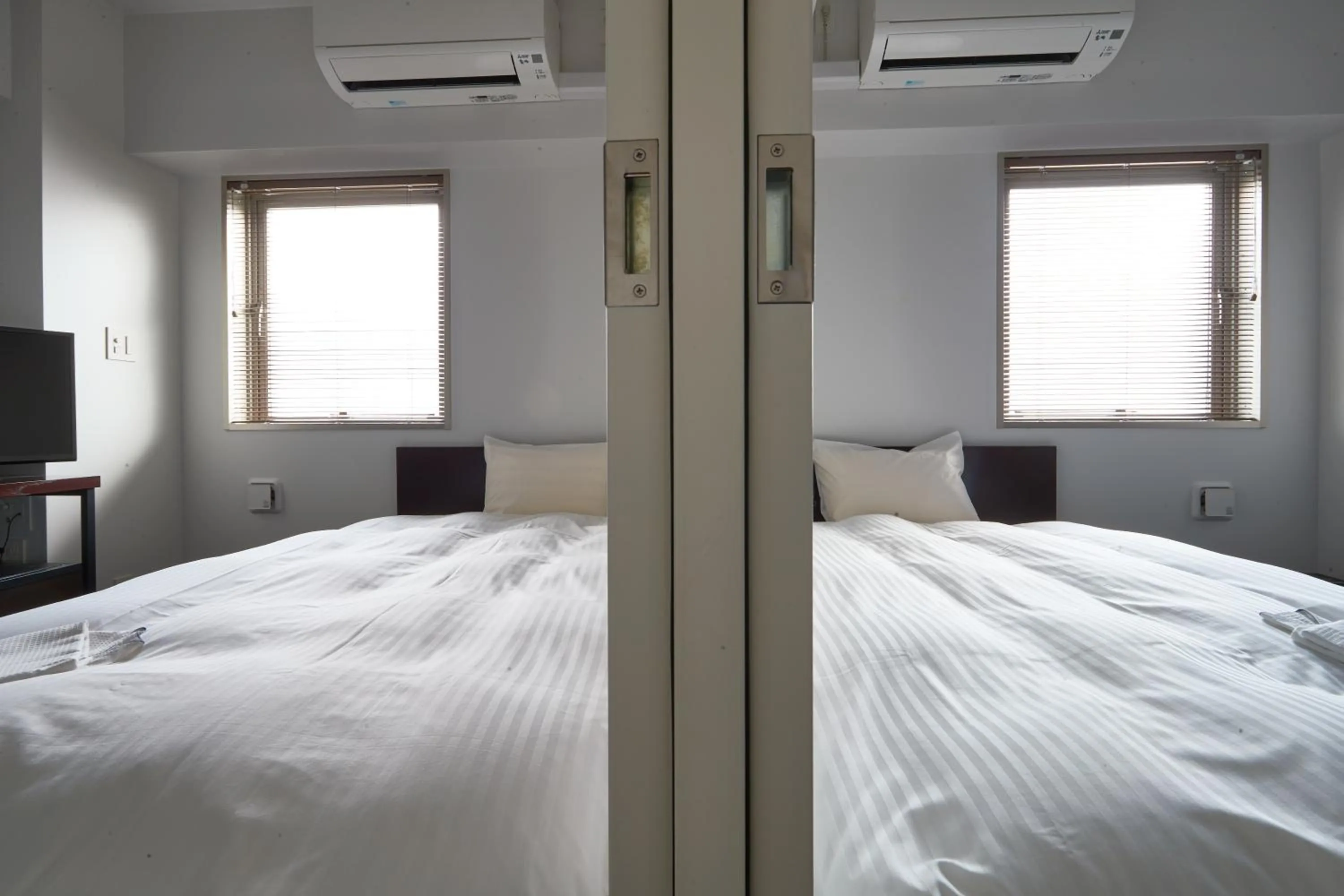 Bed in 8HOTEL Chigasaki