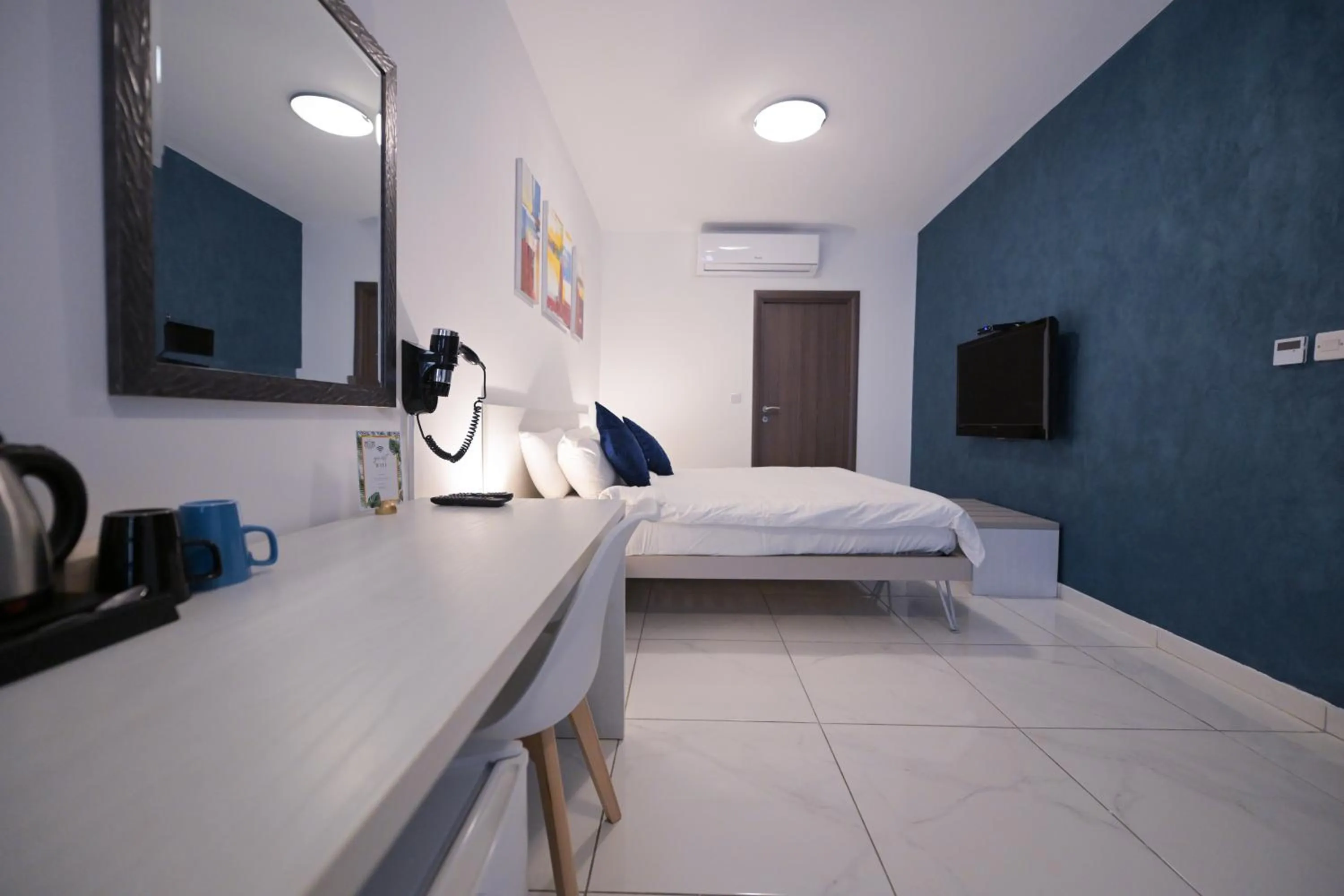 Bed in The Exiles Hotel