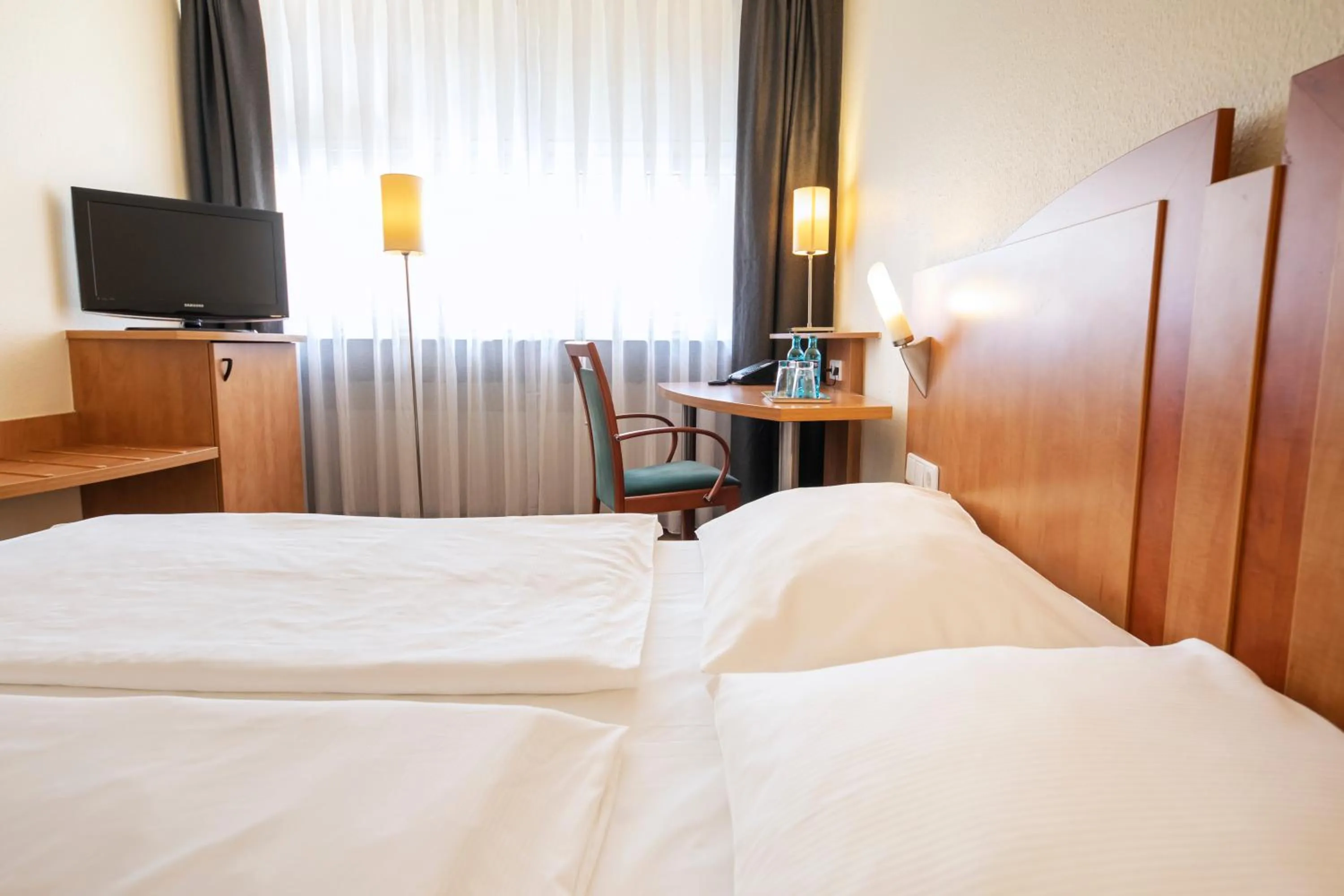 Photo of the whole room, Bed in ACHAT Hotel Braunschweig