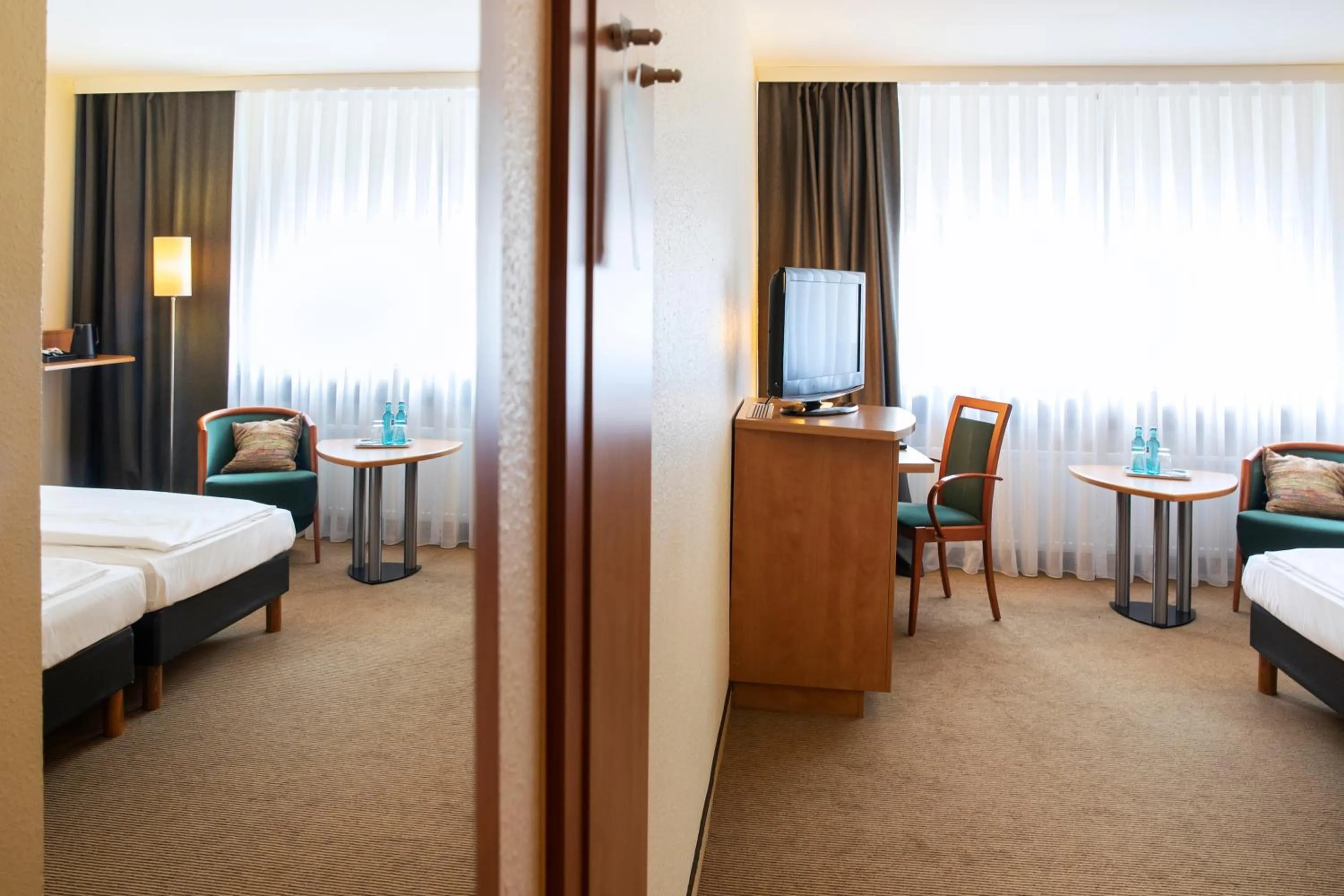 Photo of the whole room, Bed in ACHAT Hotel Braunschweig