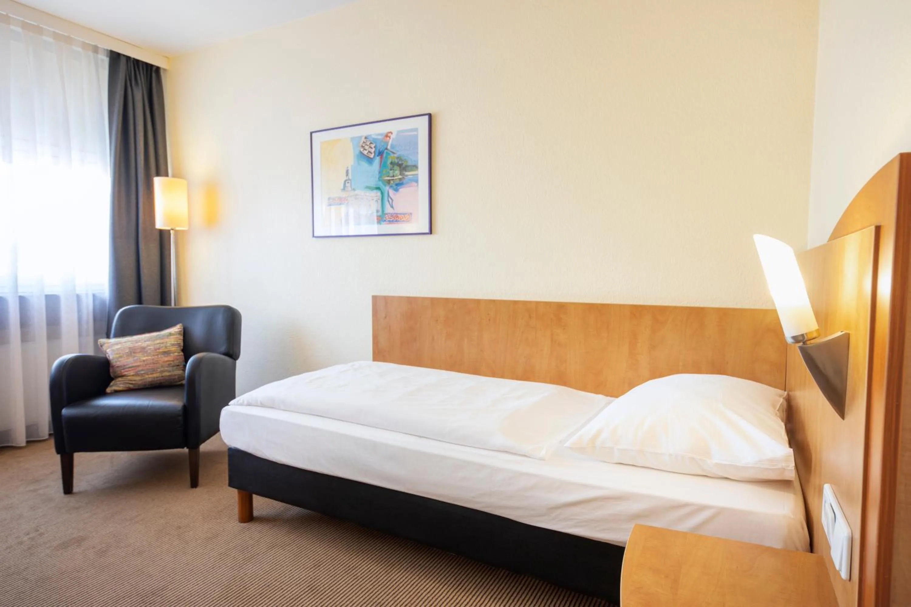 Photo of the whole room, Bed in ACHAT Hotel Braunschweig