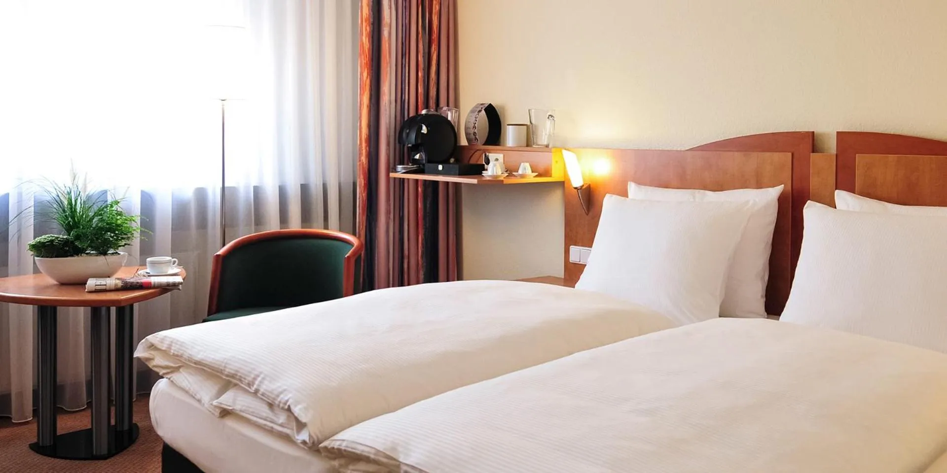 Photo of the whole room, Bed in ACHAT Hotel Braunschweig