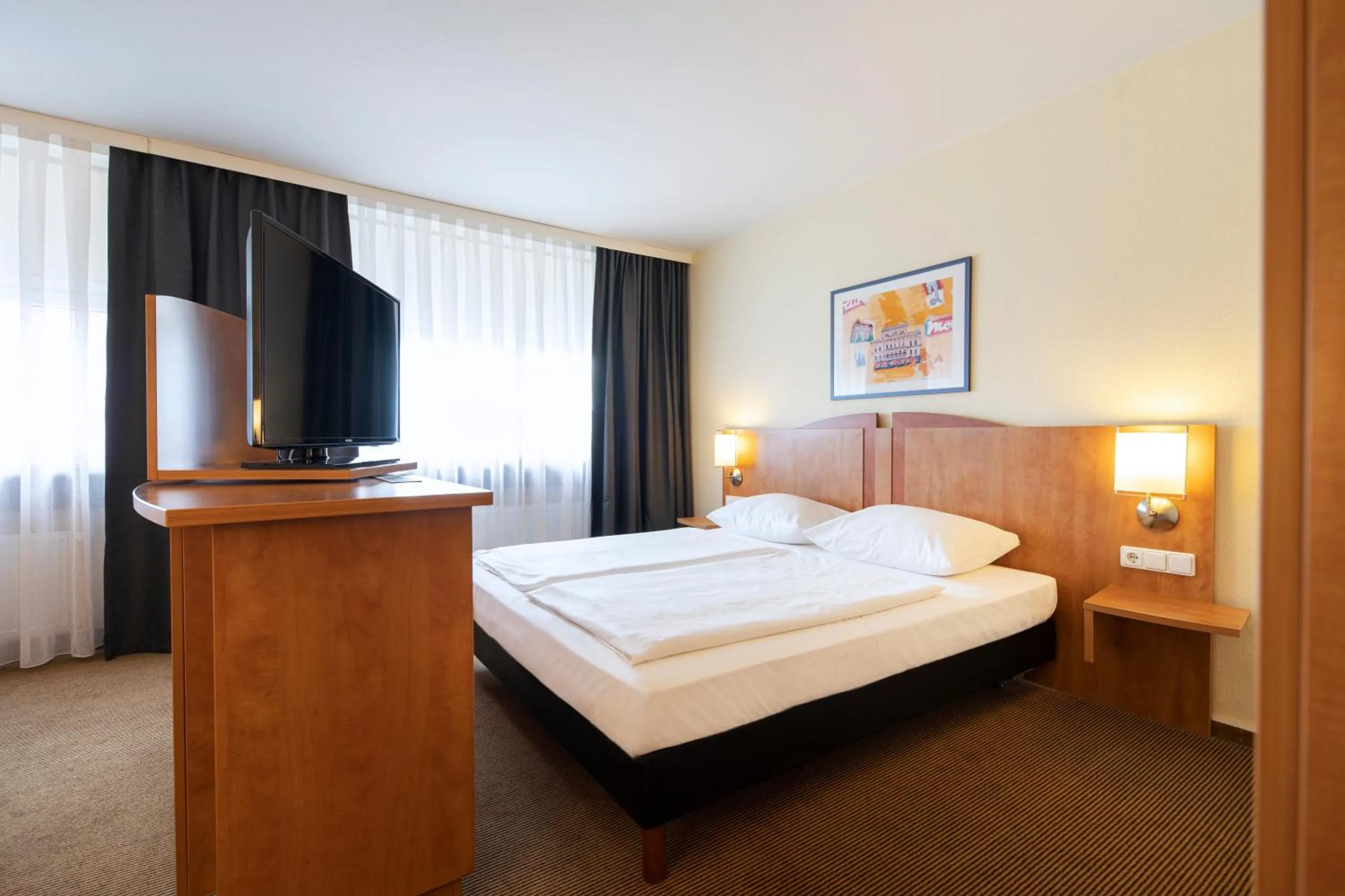 Photo of the whole room, Bed in ACHAT Hotel Braunschweig
