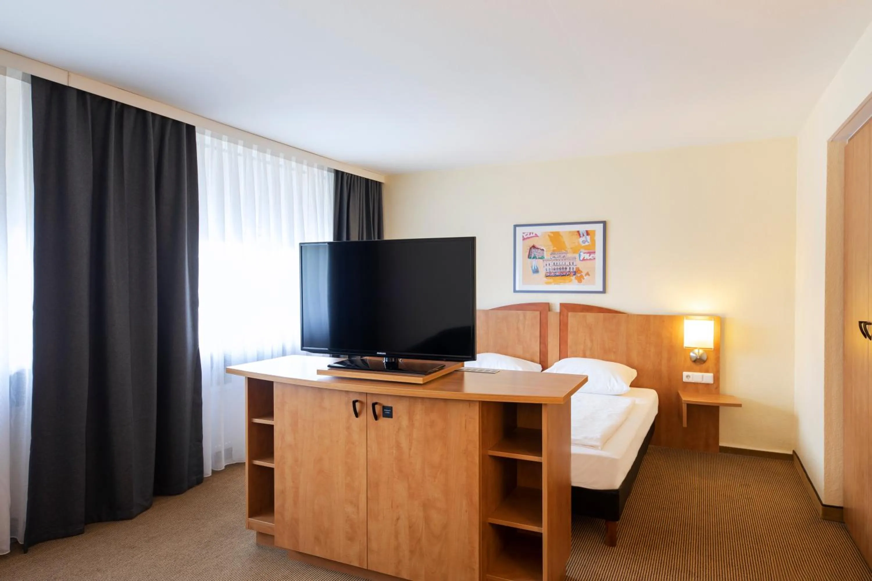 Photo of the whole room, Bed in ACHAT Hotel Braunschweig