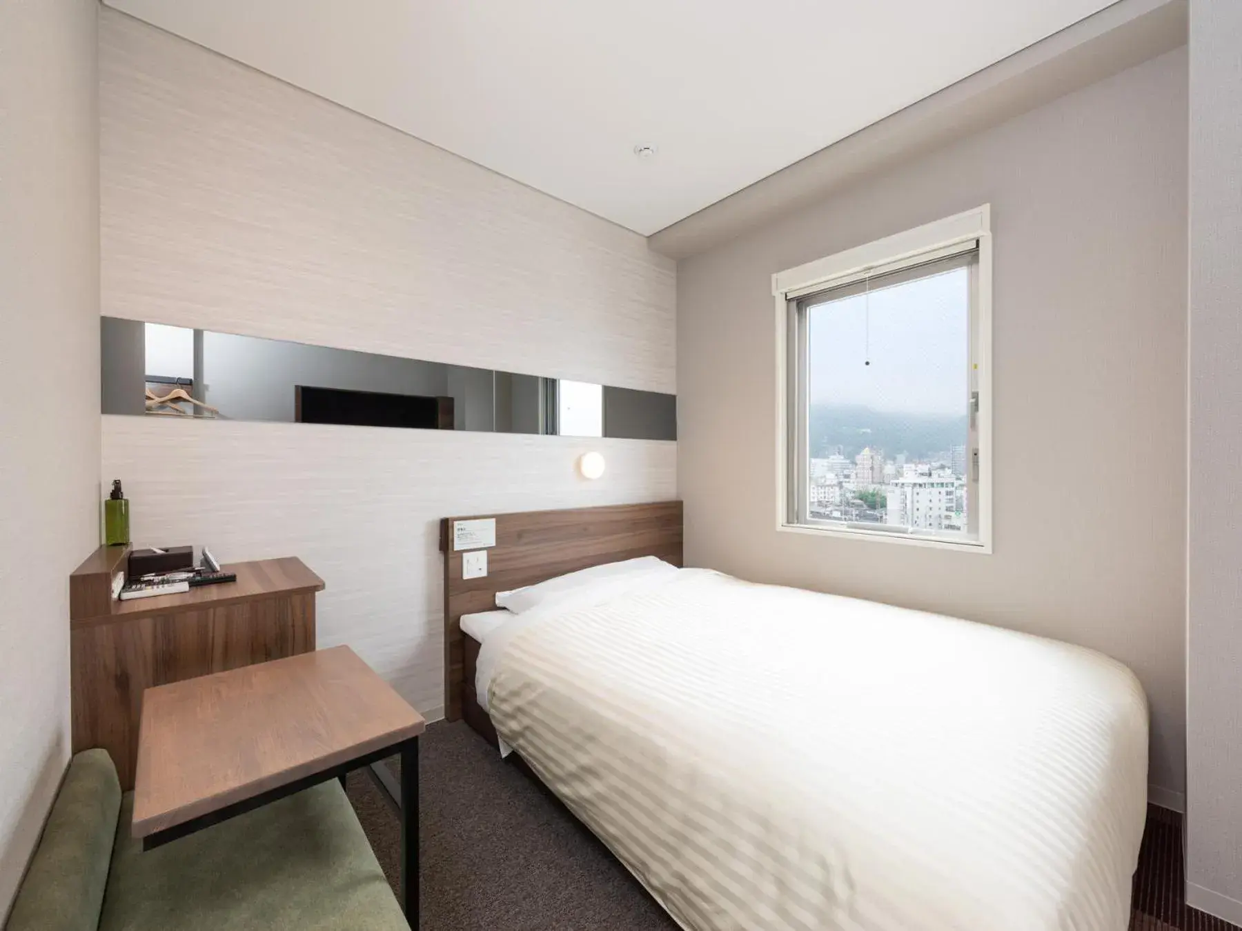 Bed in Super Hotel Beppu Ekimae Bed in Super Hotel Beppu Ekimae