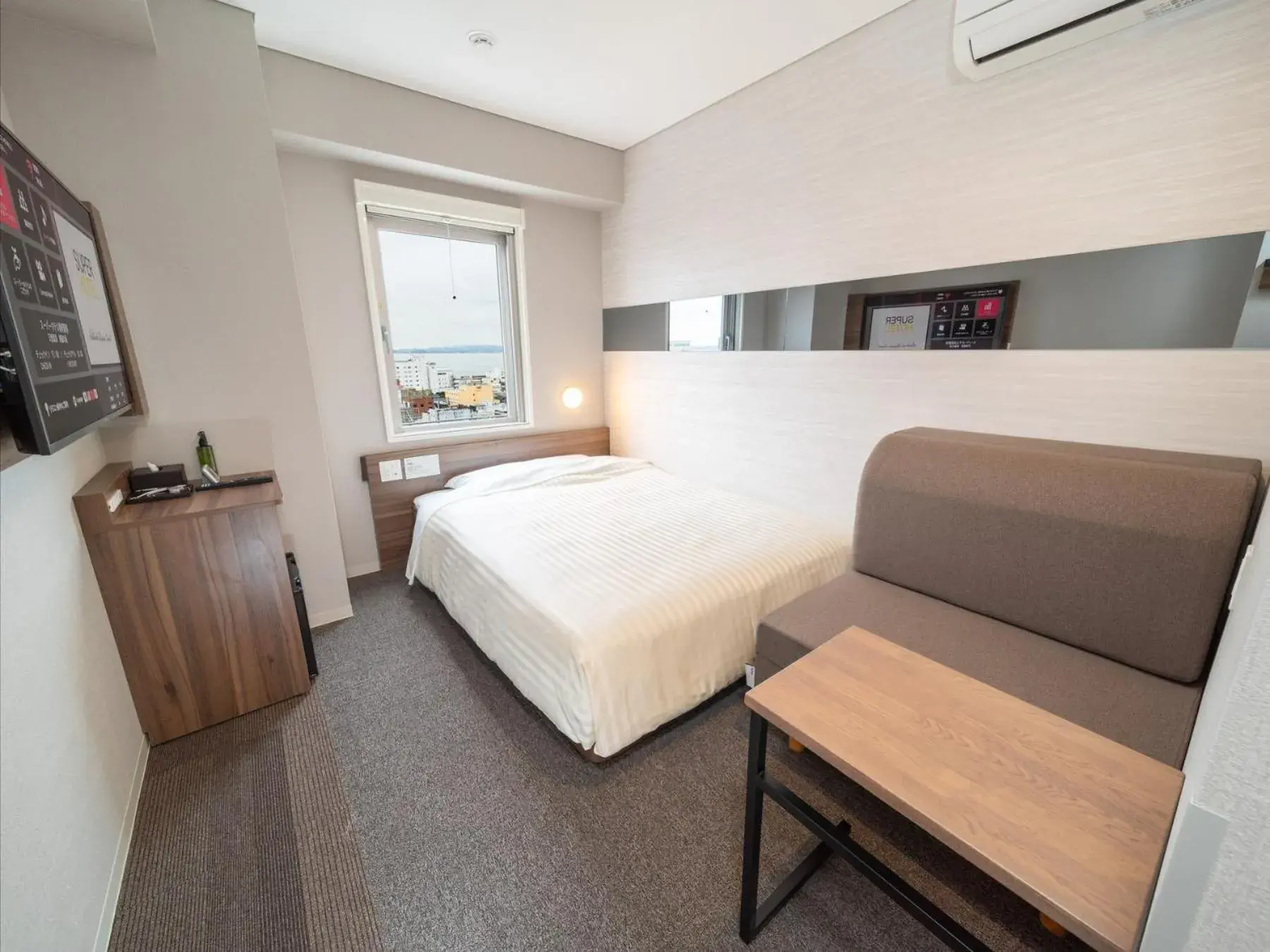 Bed in Super Hotel Beppu Ekimae Bed in Super Hotel Beppu Ekimae